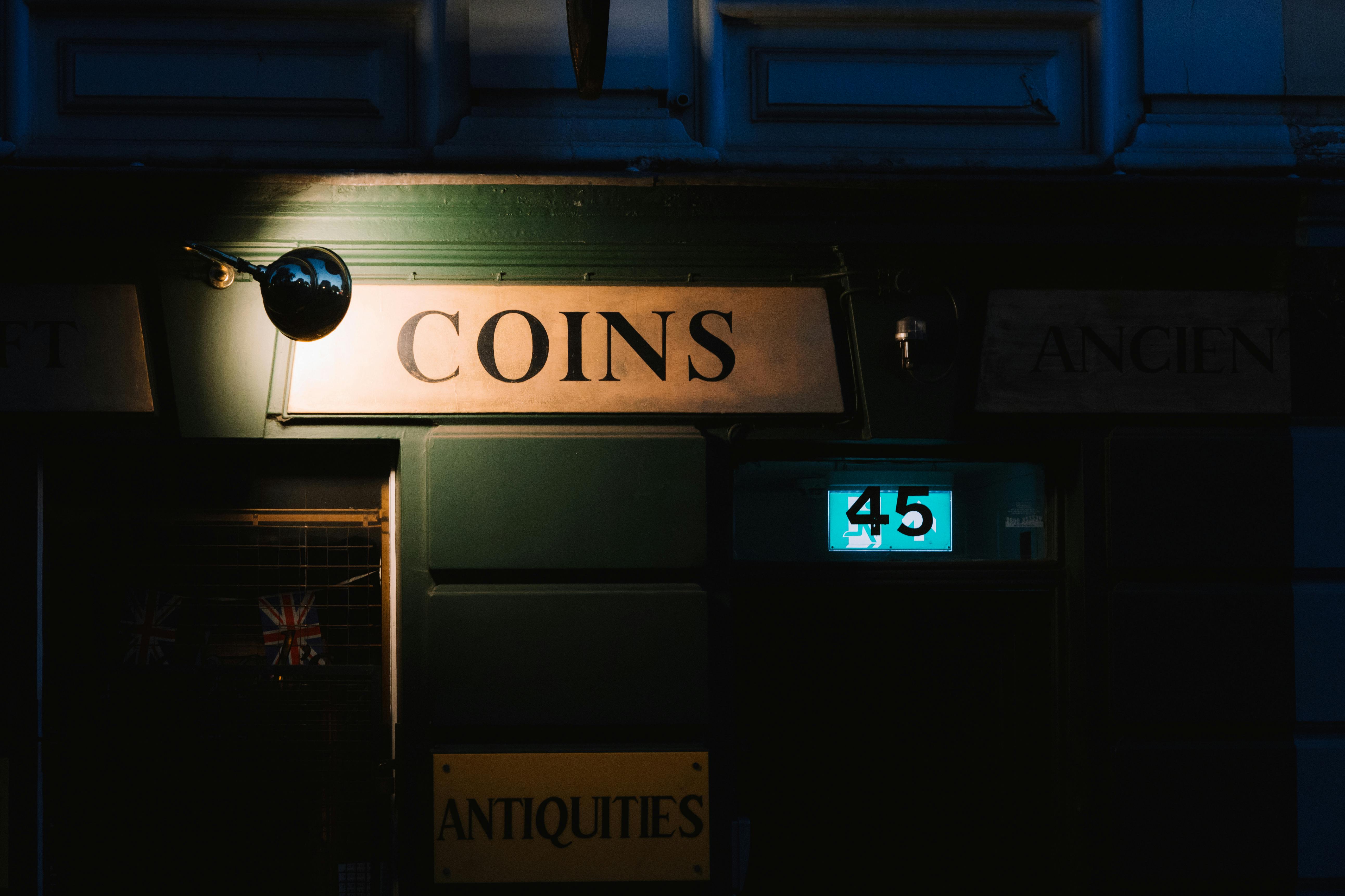 Illuminated Vintage Shop Sign at Night