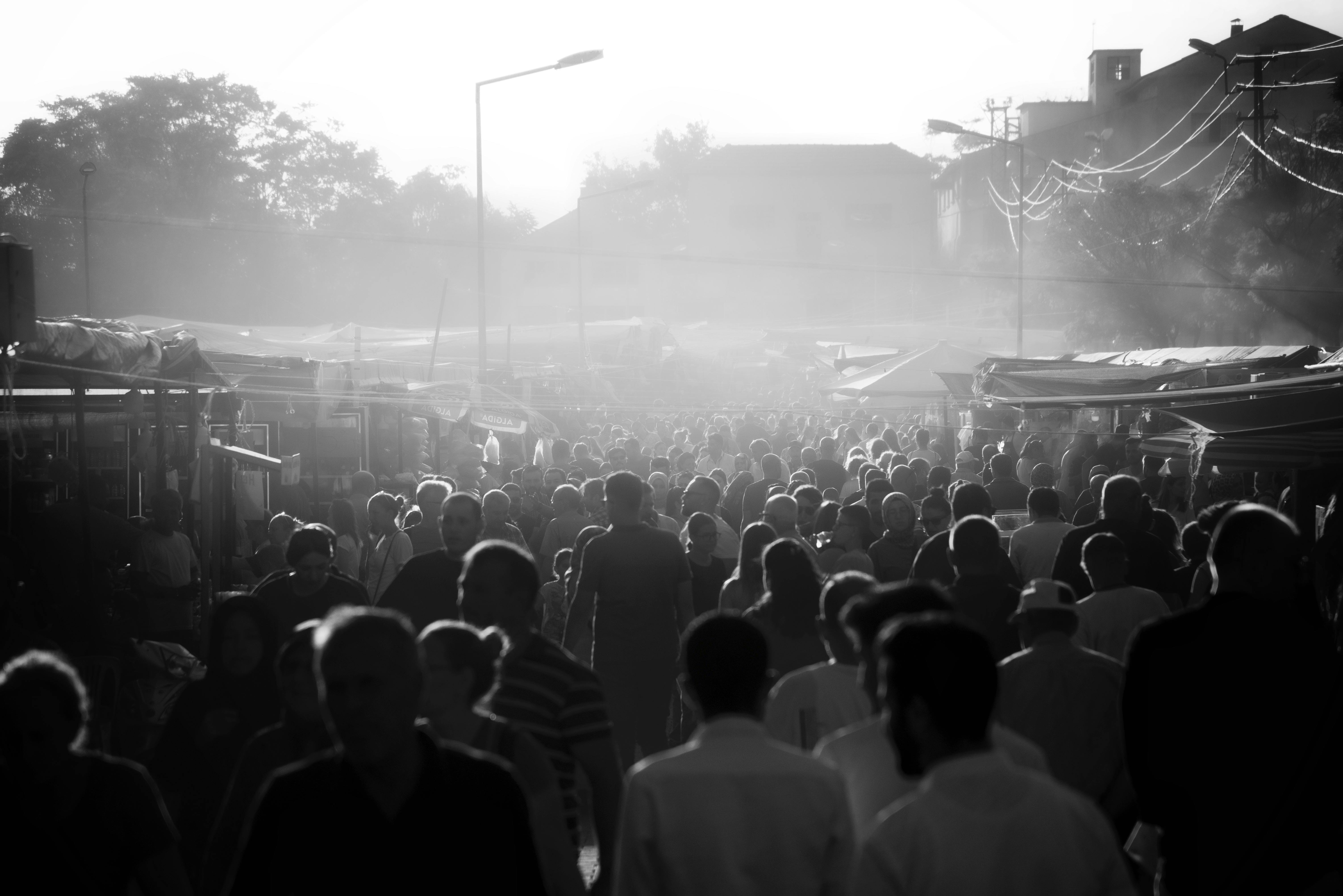 Black and White Photo of a Crowd on a Market