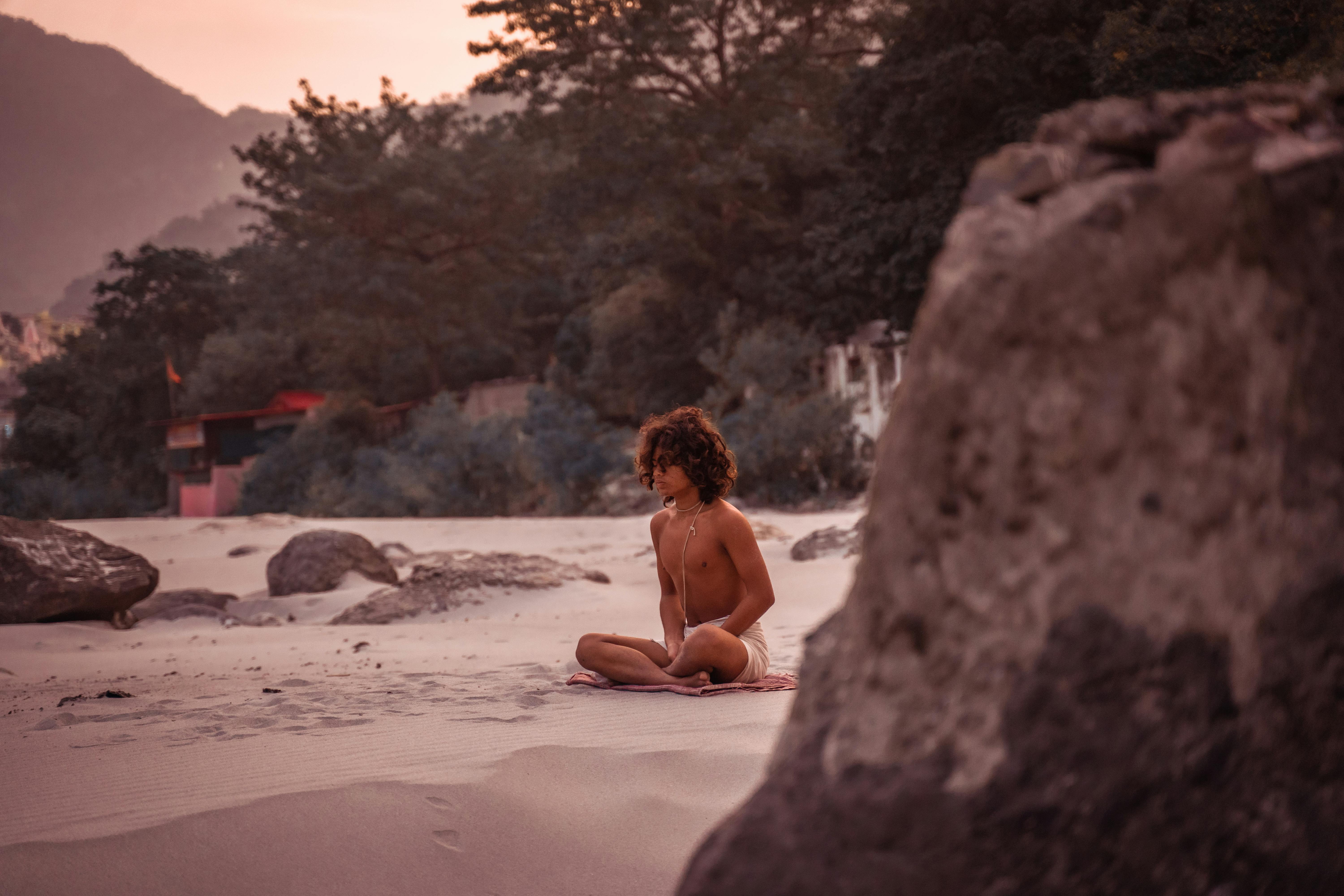 Sadhu on Beach of Uttarakhand during Tapas Religious Meditation