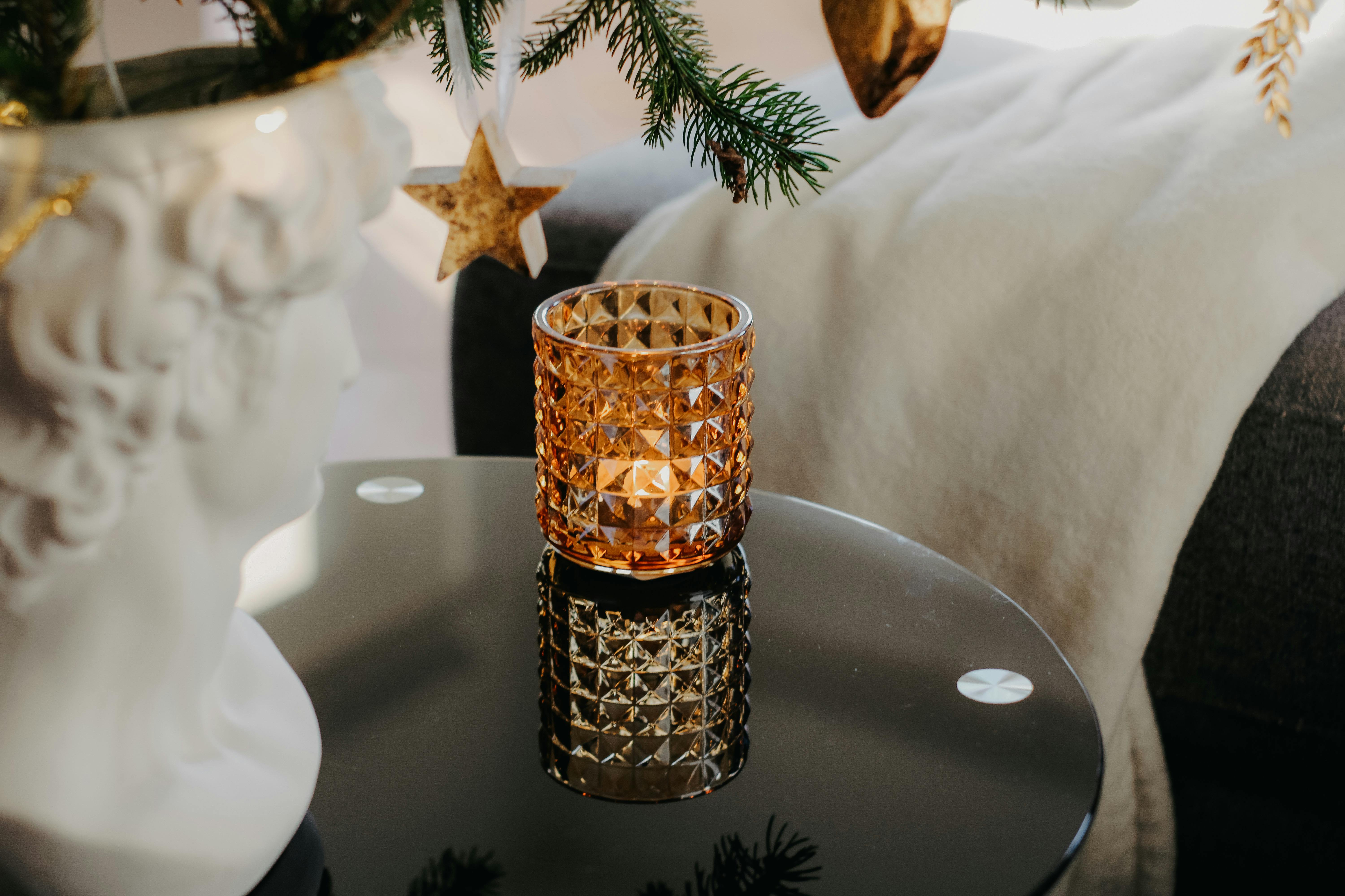 Elegant Candle and Christmas Tree on Coffee Table