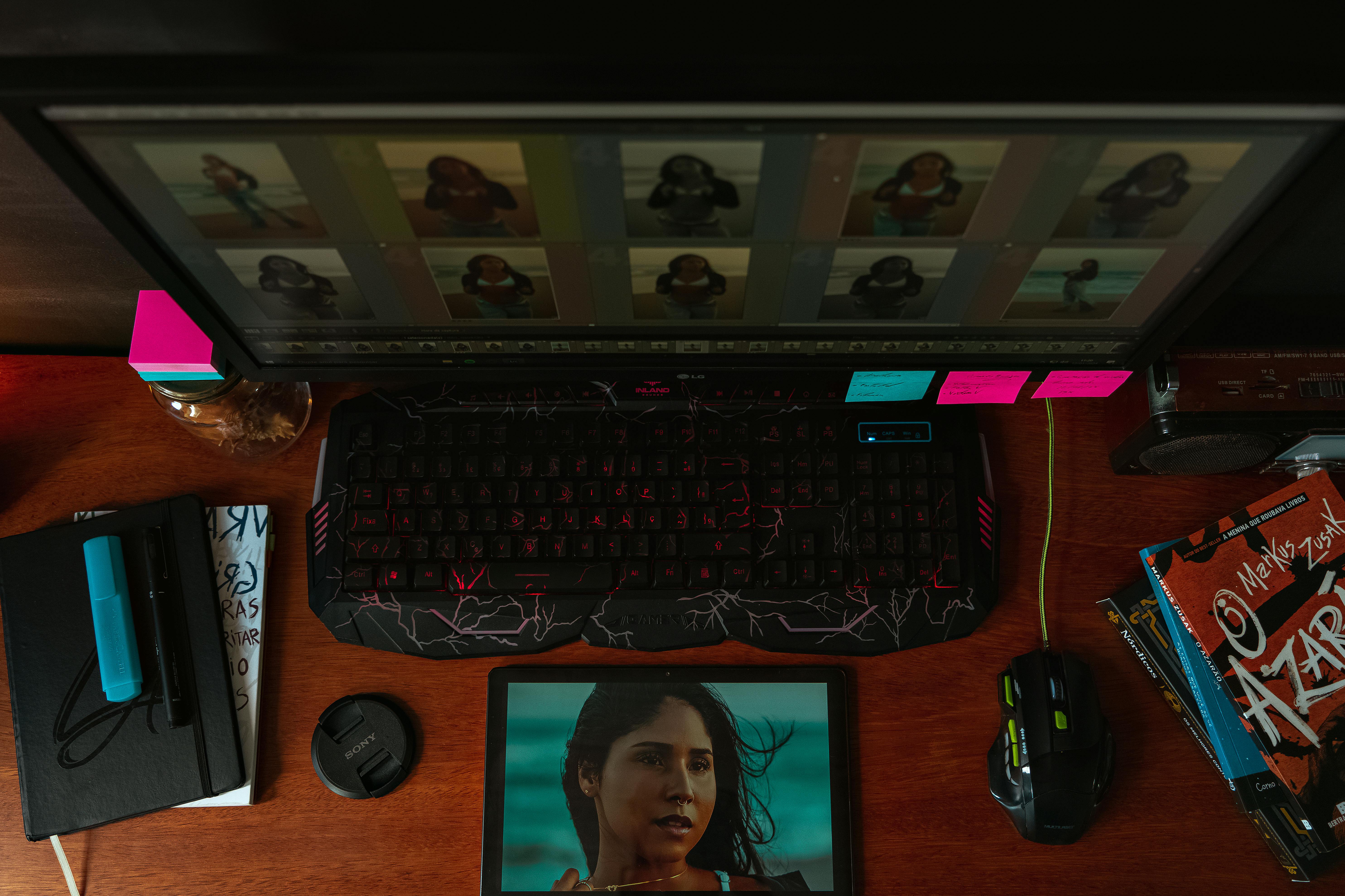 A Computer Monitor and Tablet Displaying Pictures of a Woman