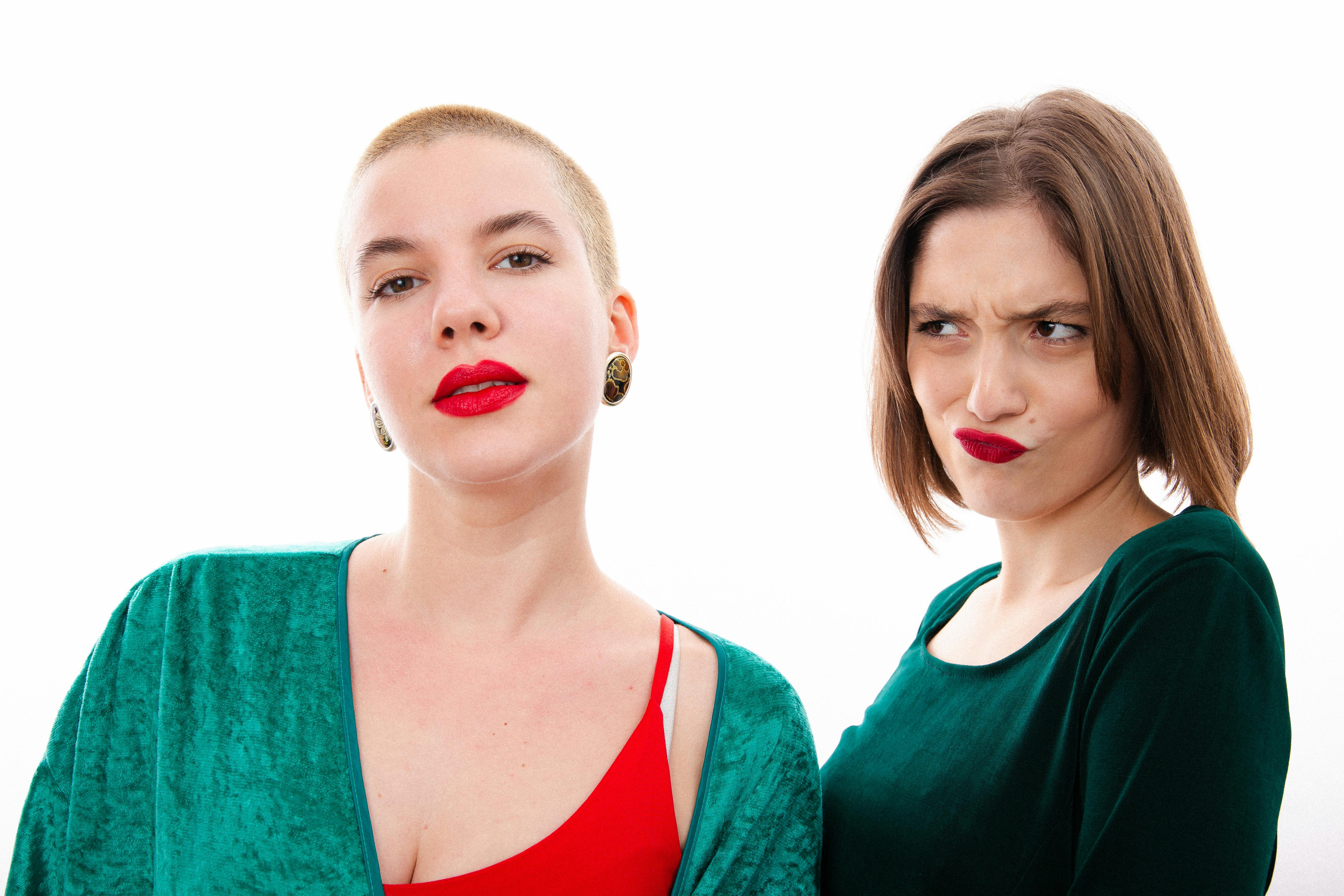 Brunette Woman Looking at Short Haired Woman in Studio