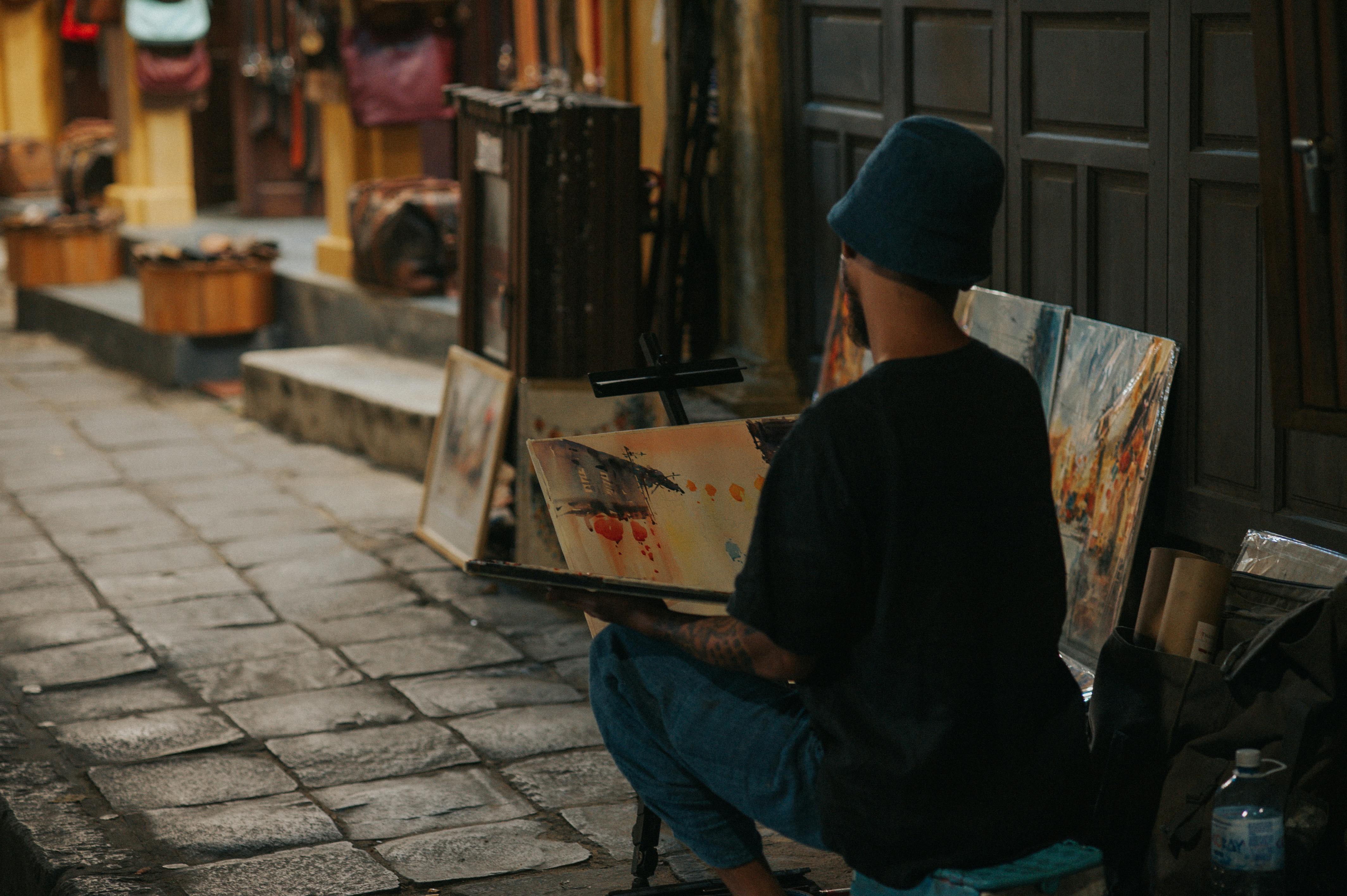 Back View of Street Artist Painting