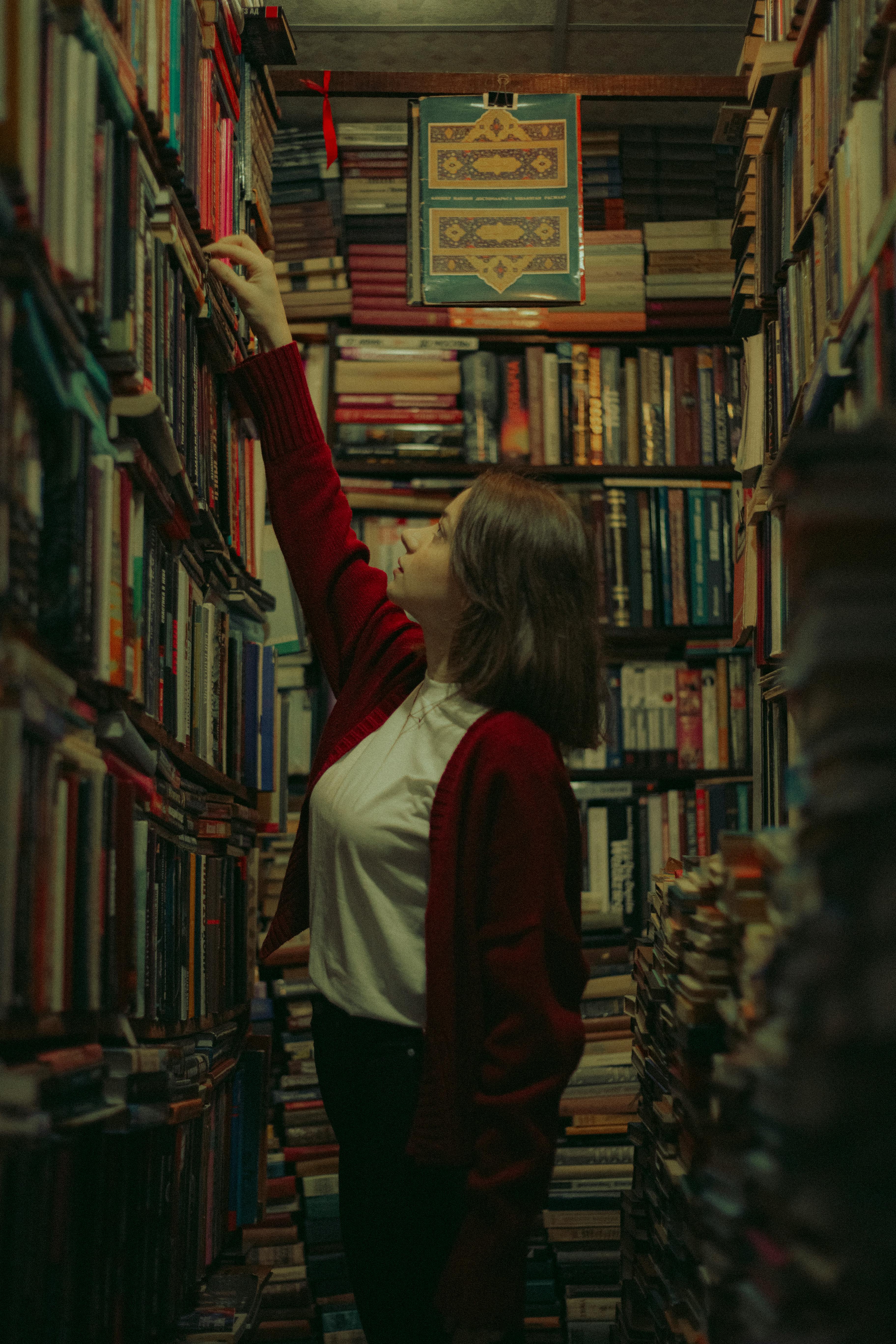 Woman Choosing Books in Library