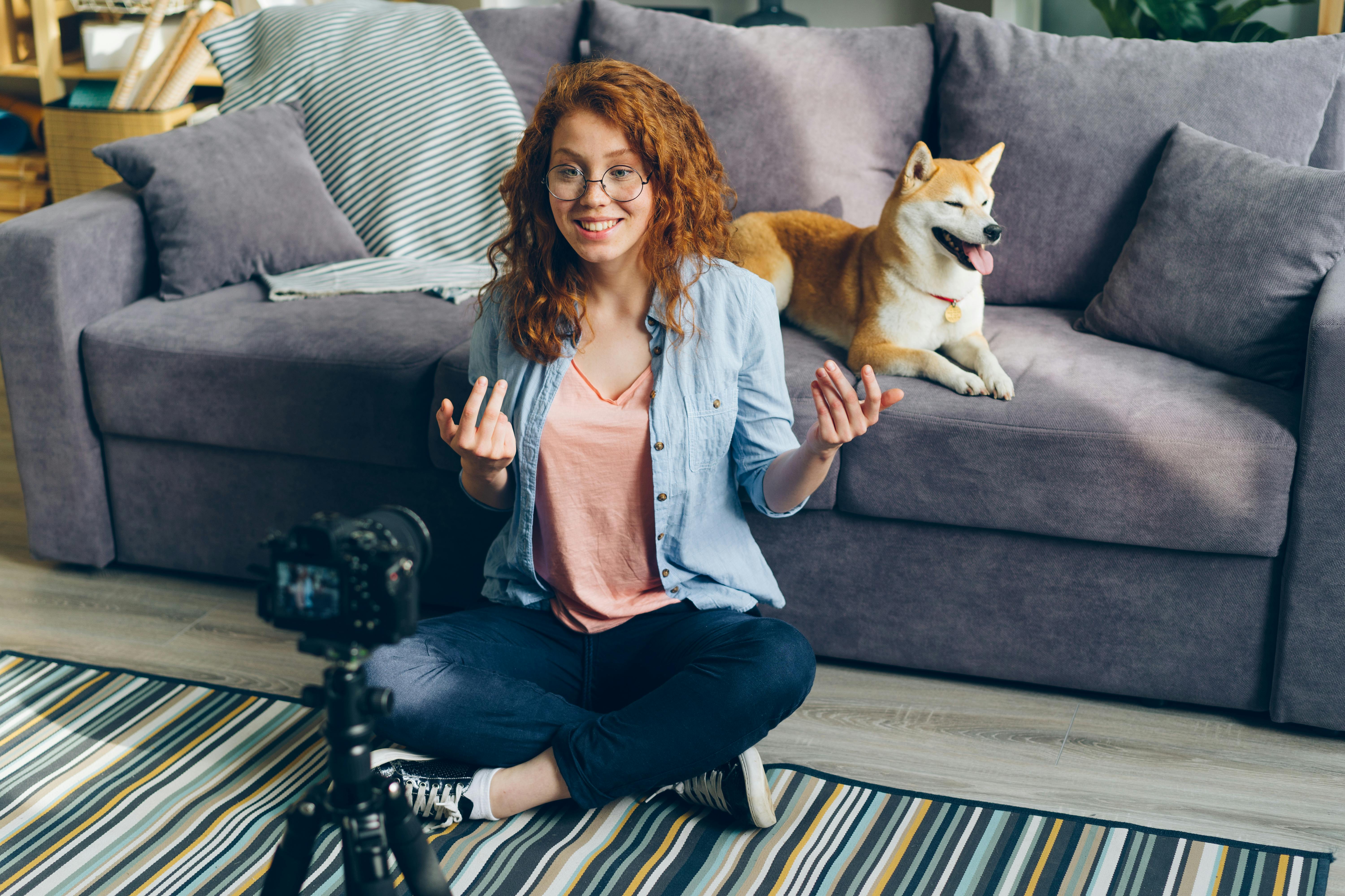 Smiling Woman Sitting in front of Camera