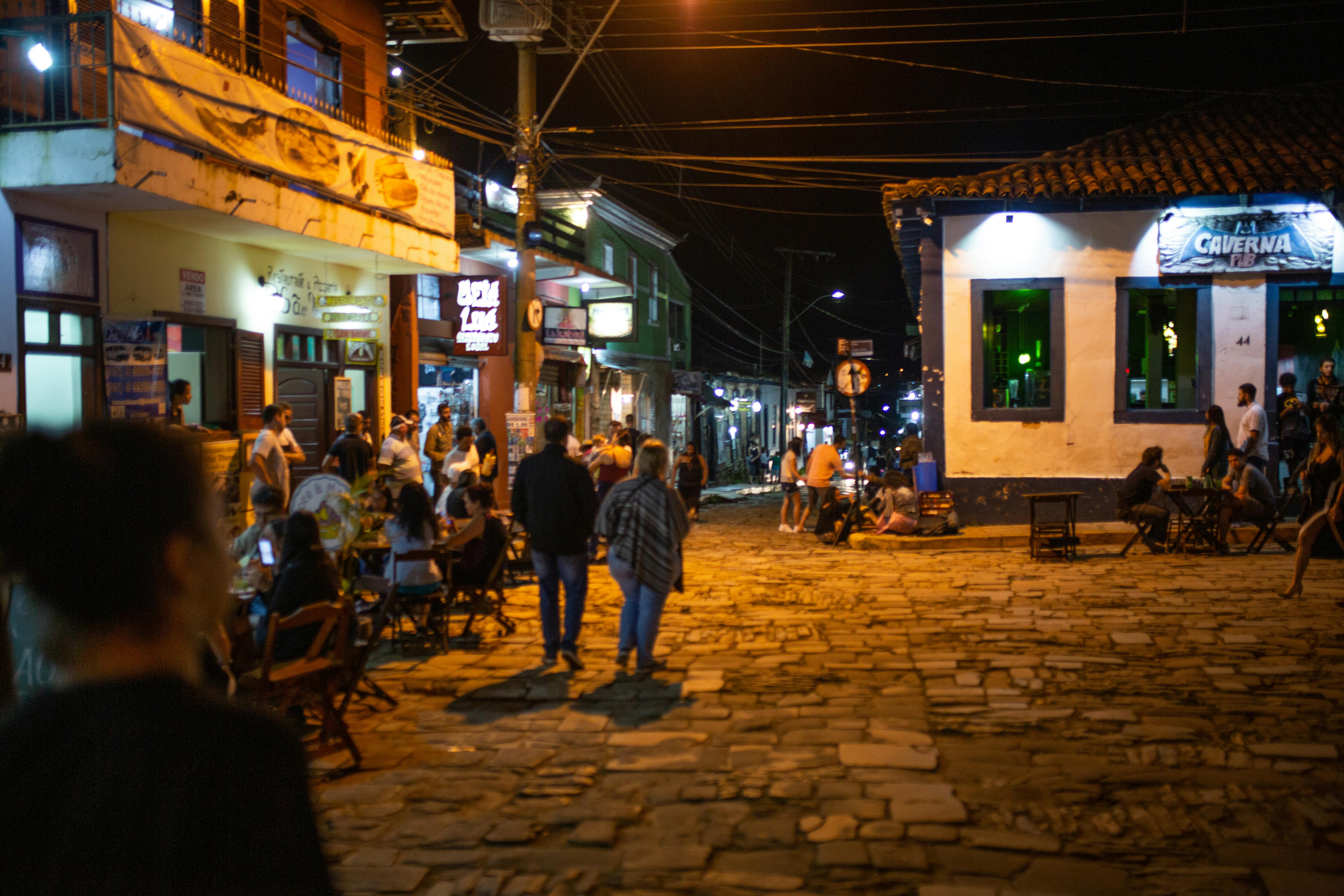 People Outside the Building during Nighttime