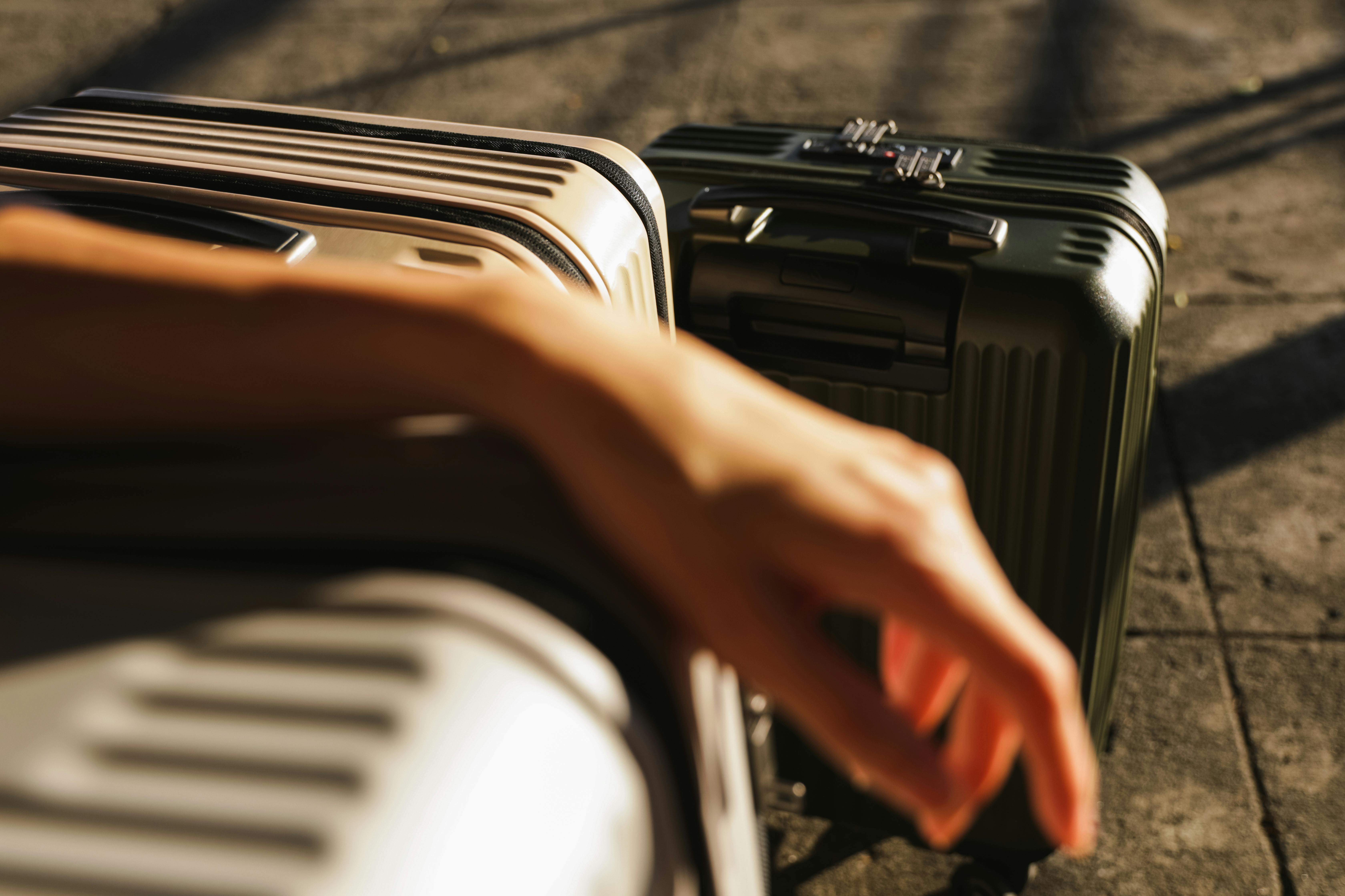 Hand Resting On the Luggage