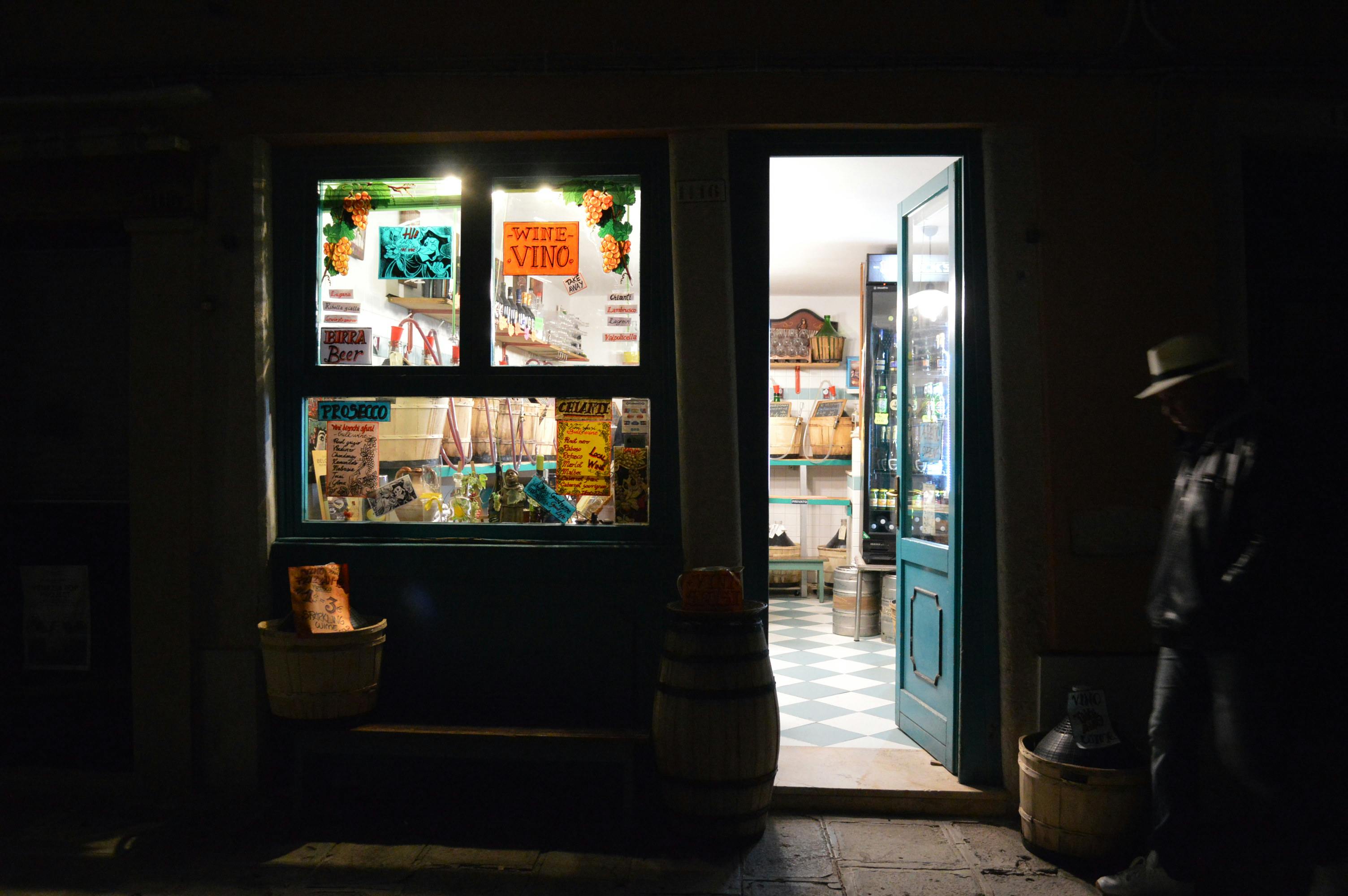 Person Standing Near Blue Door Outdoors