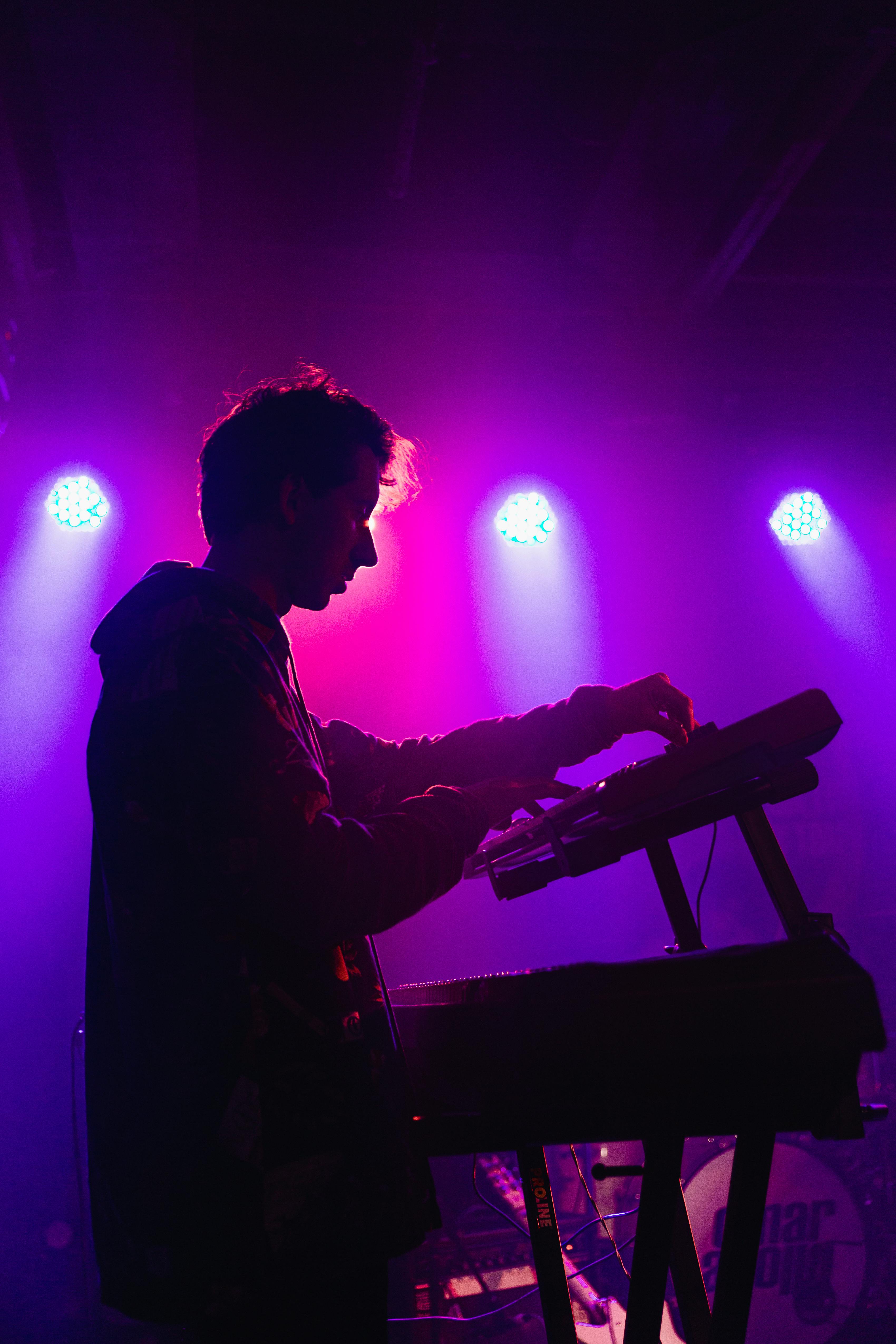 Man holding DJ mixer machine