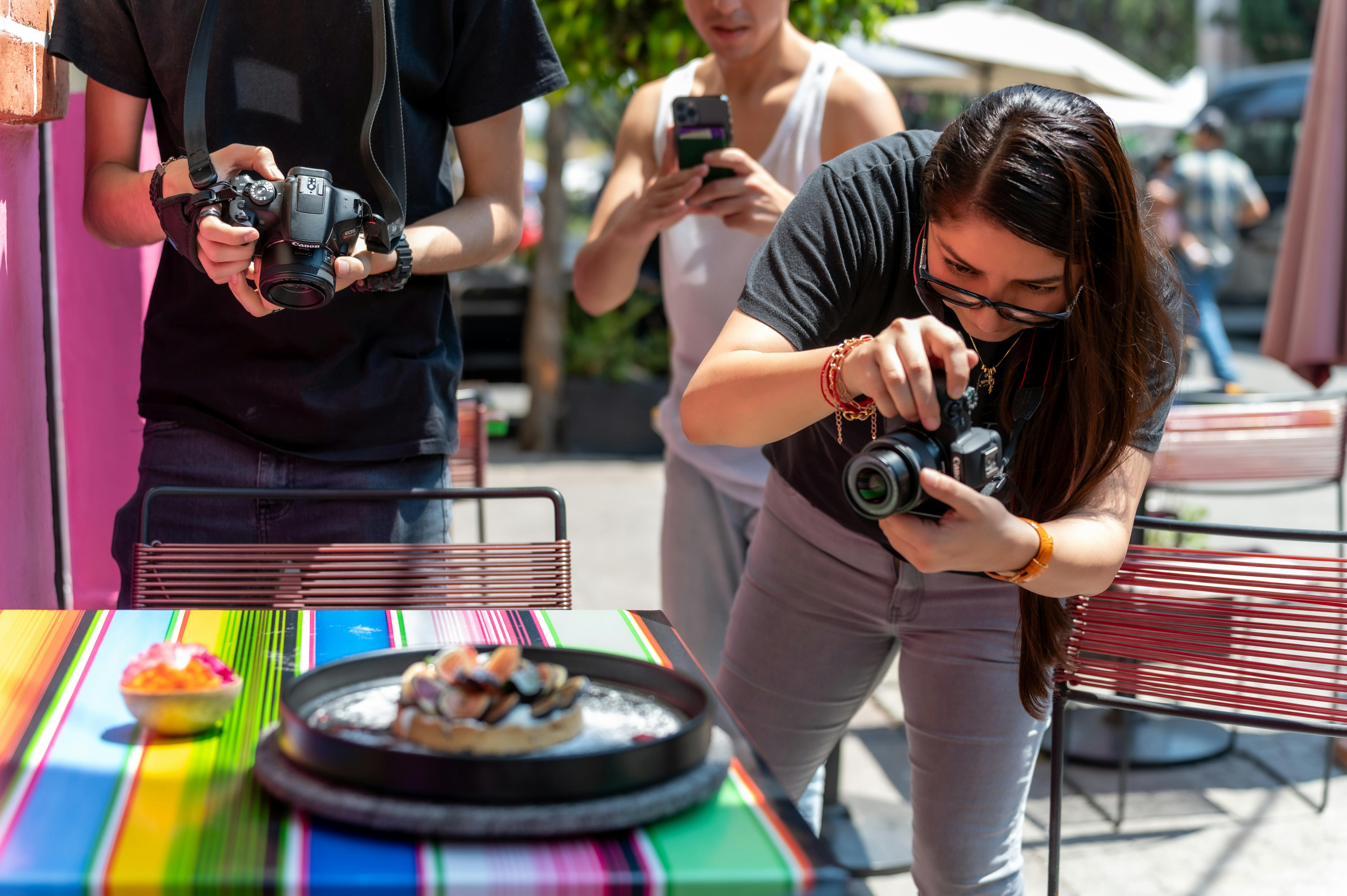 Photographers Taking Photos of Meal on Plate