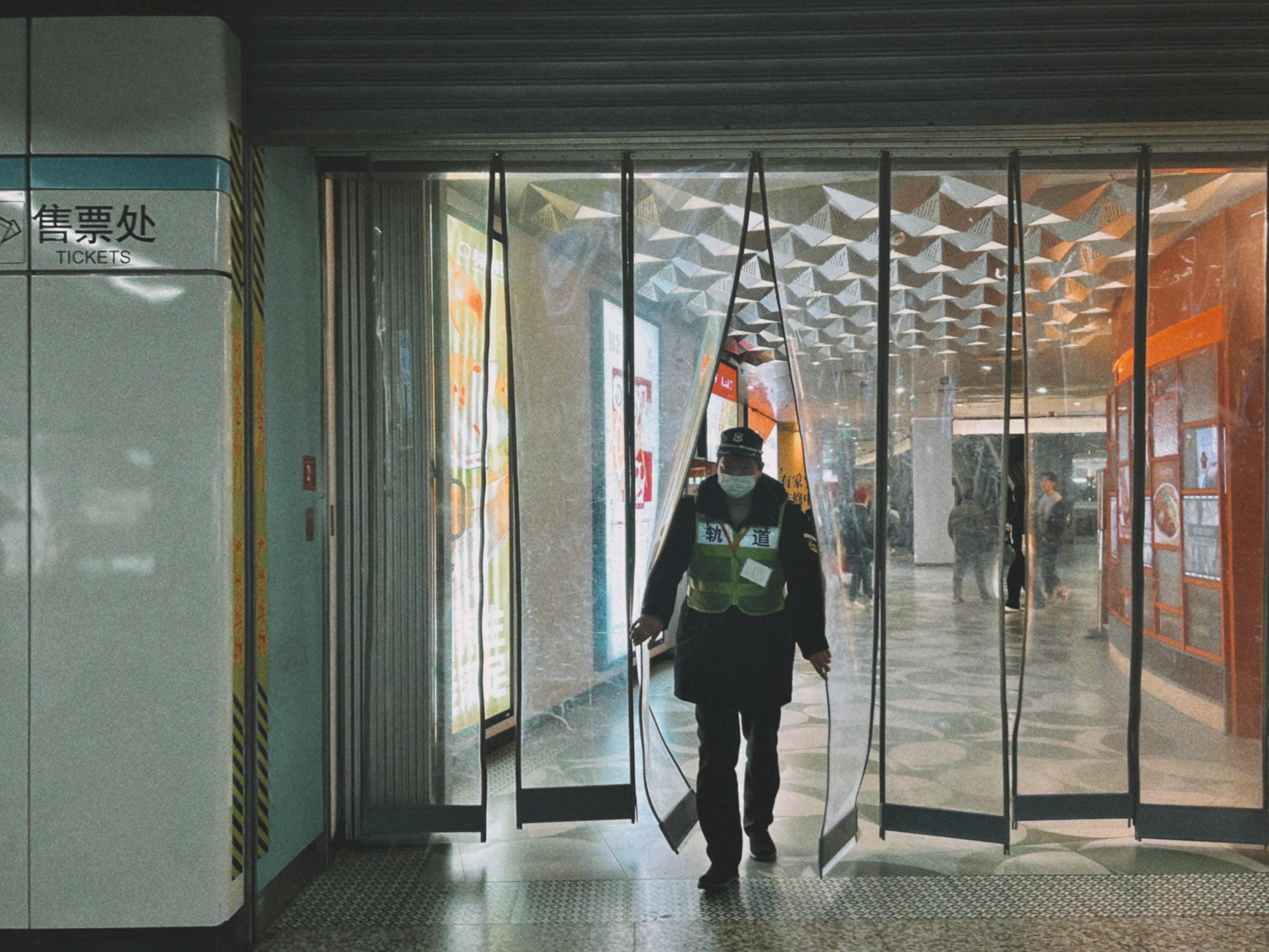 Security Walking through Building Entrance