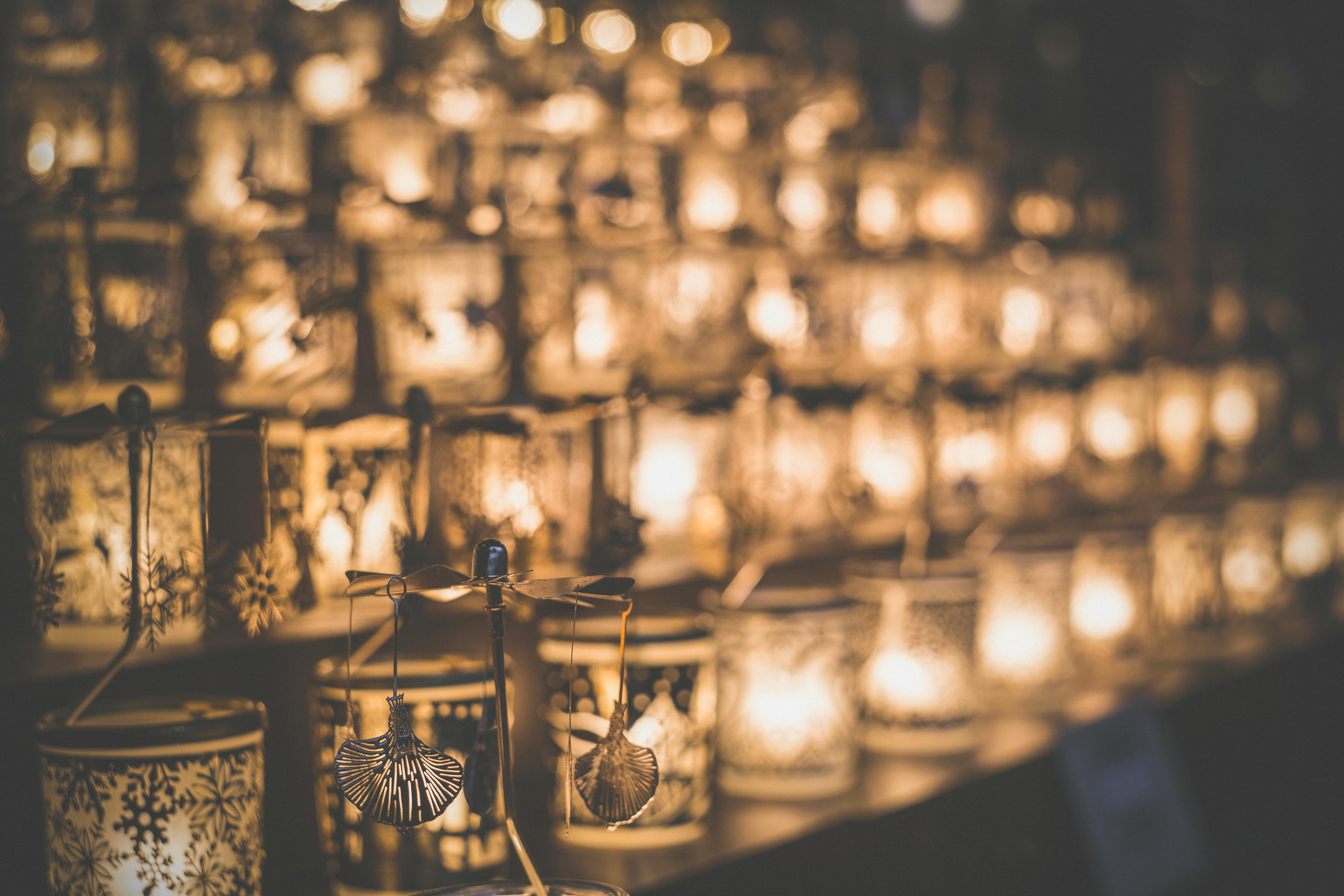 Clear Glass Candle Holder on Brown Wooden Table