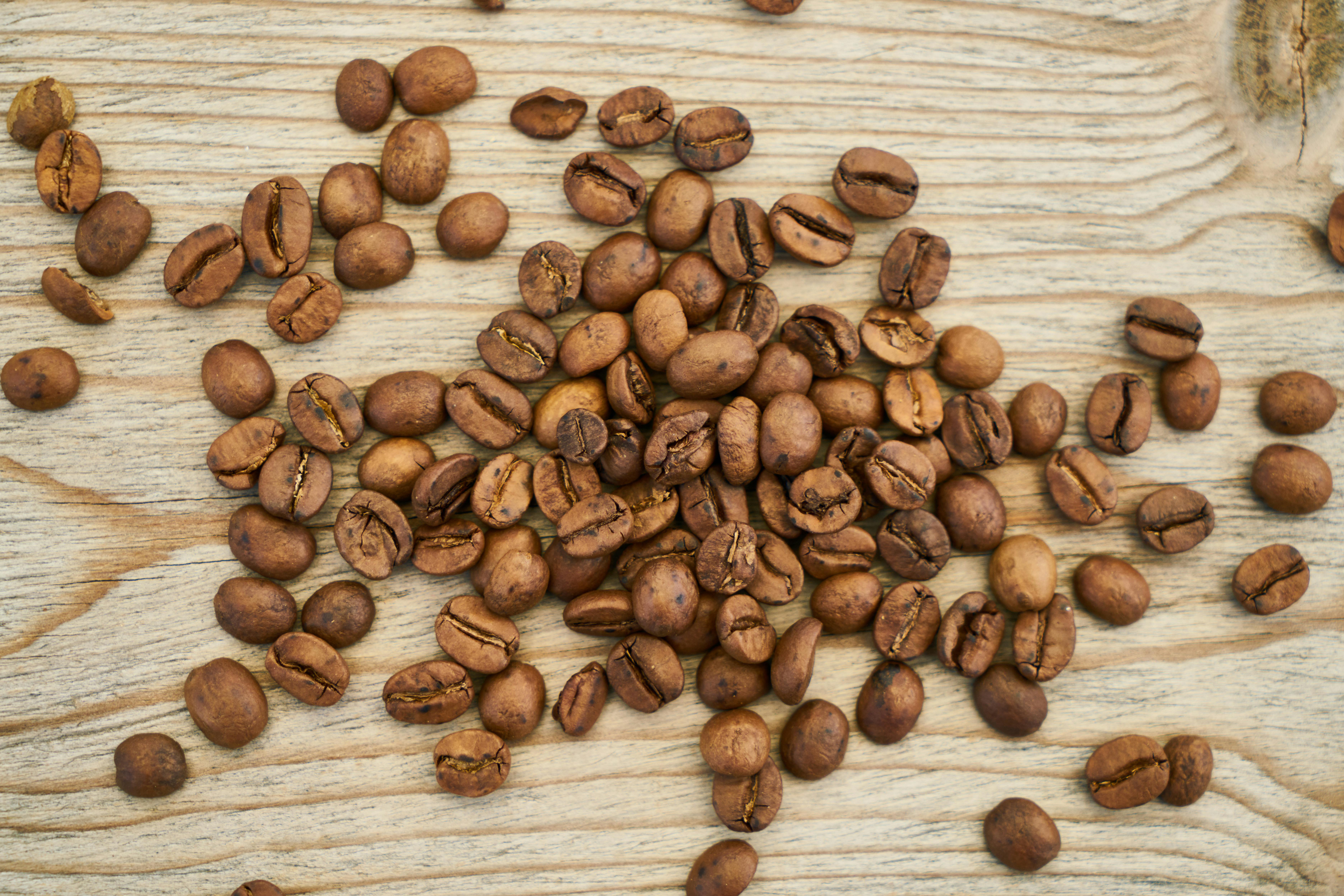 Flat Lay Photography of Coffee Beans on Wooden Surface