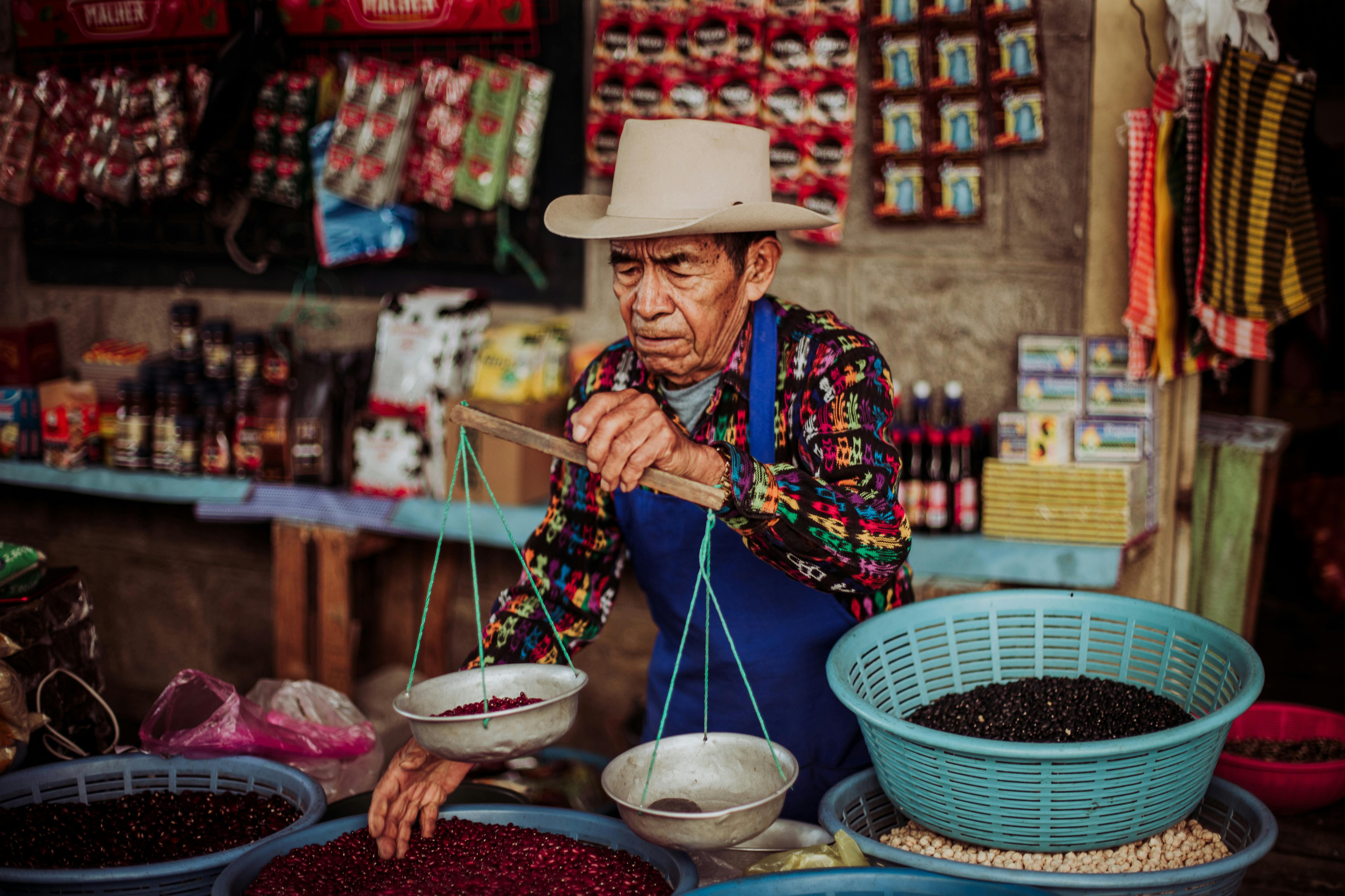 Merchant Working at Market Stall
