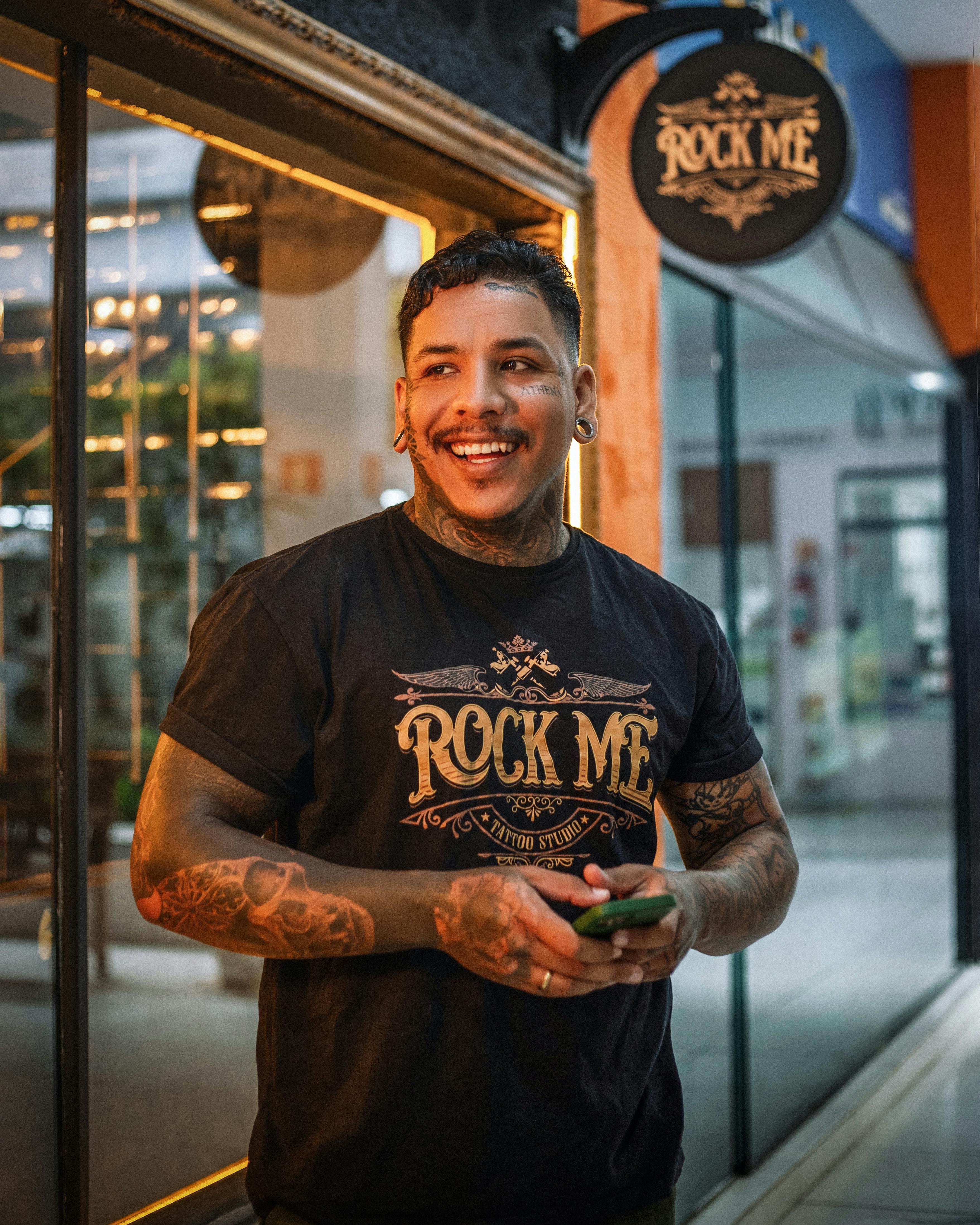 Smiling Man with Tattoos Posing