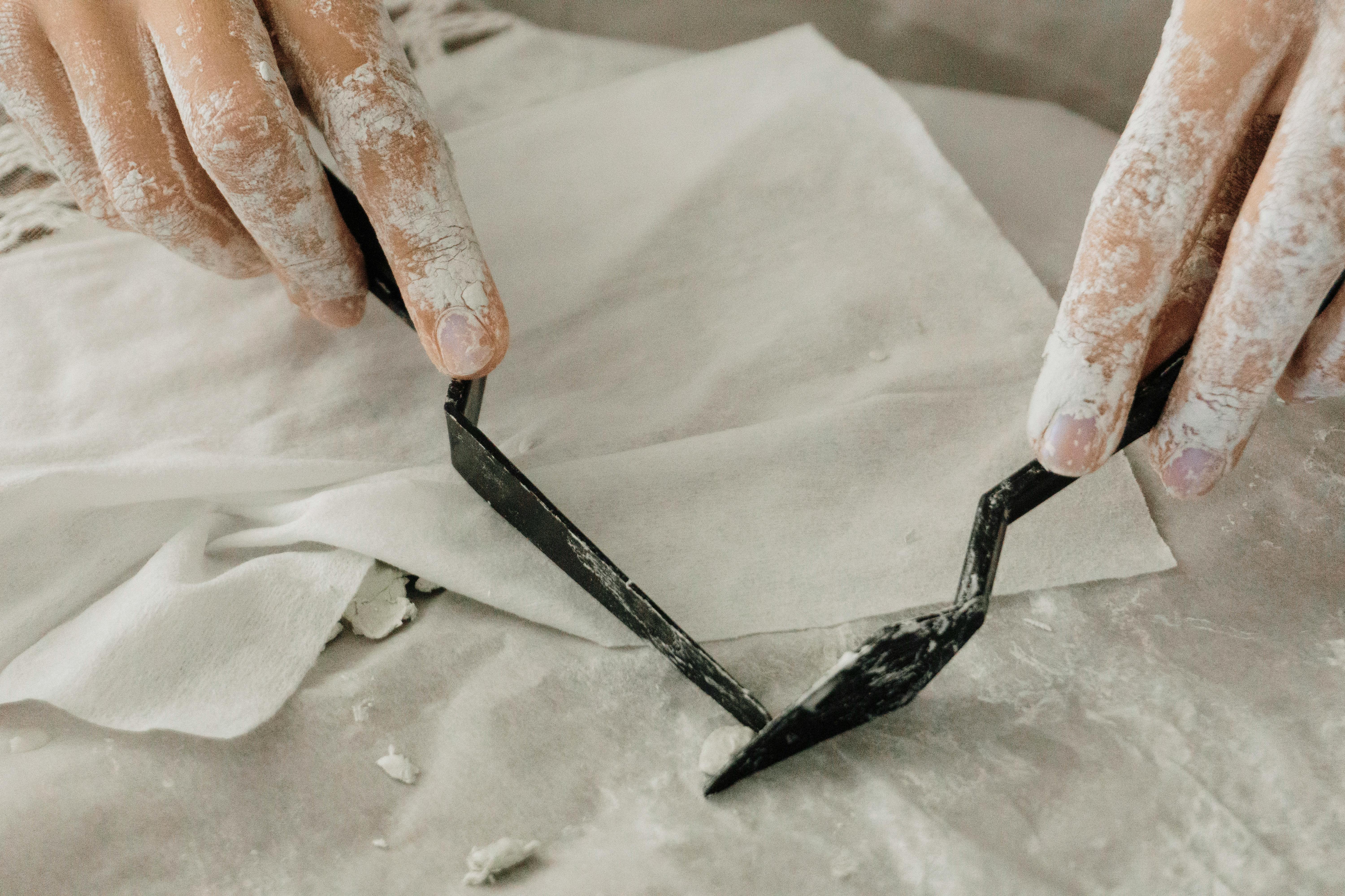 Close-up of a Person Making Small Clay Sculptures