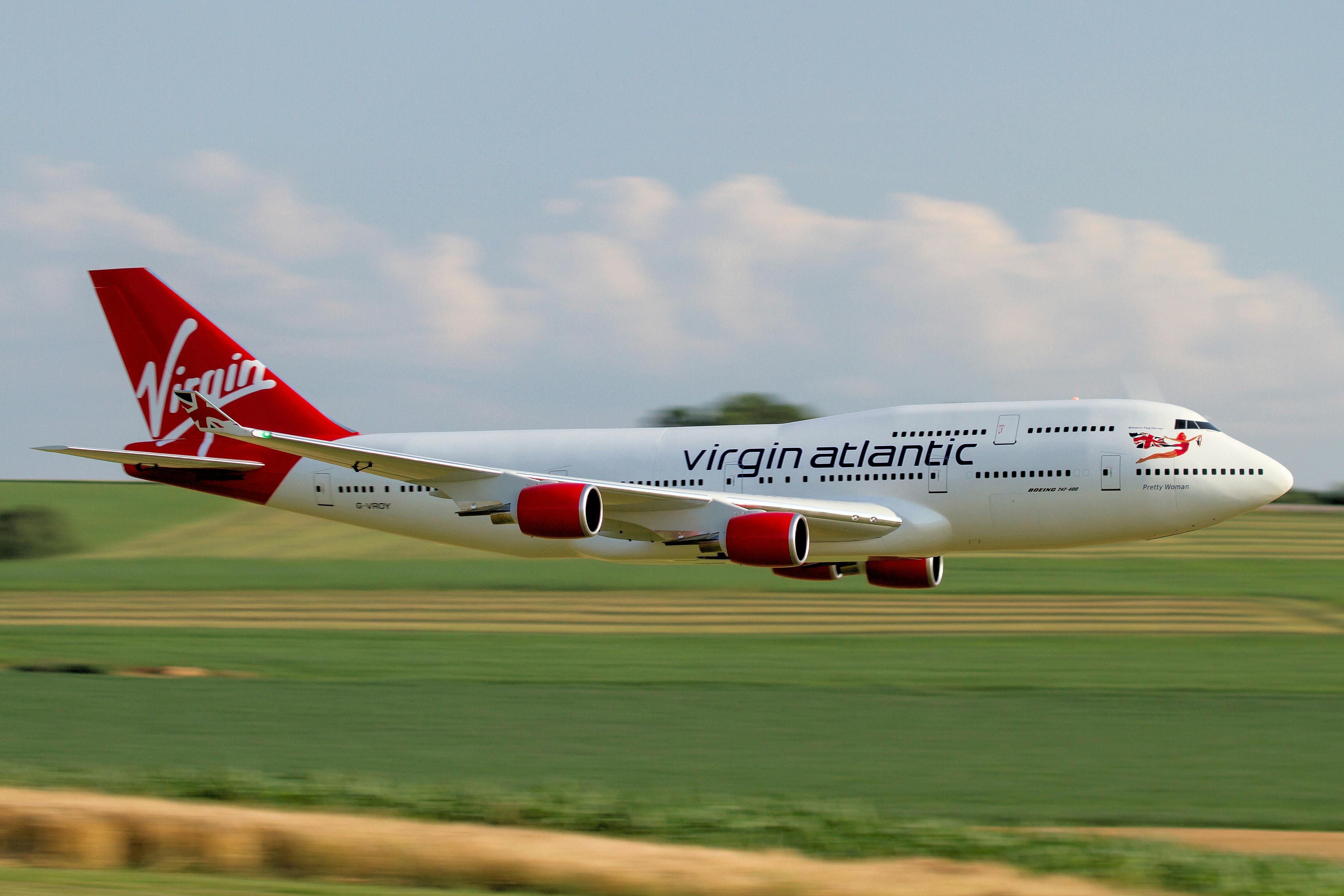 An Airplane Model Flying Above a Field