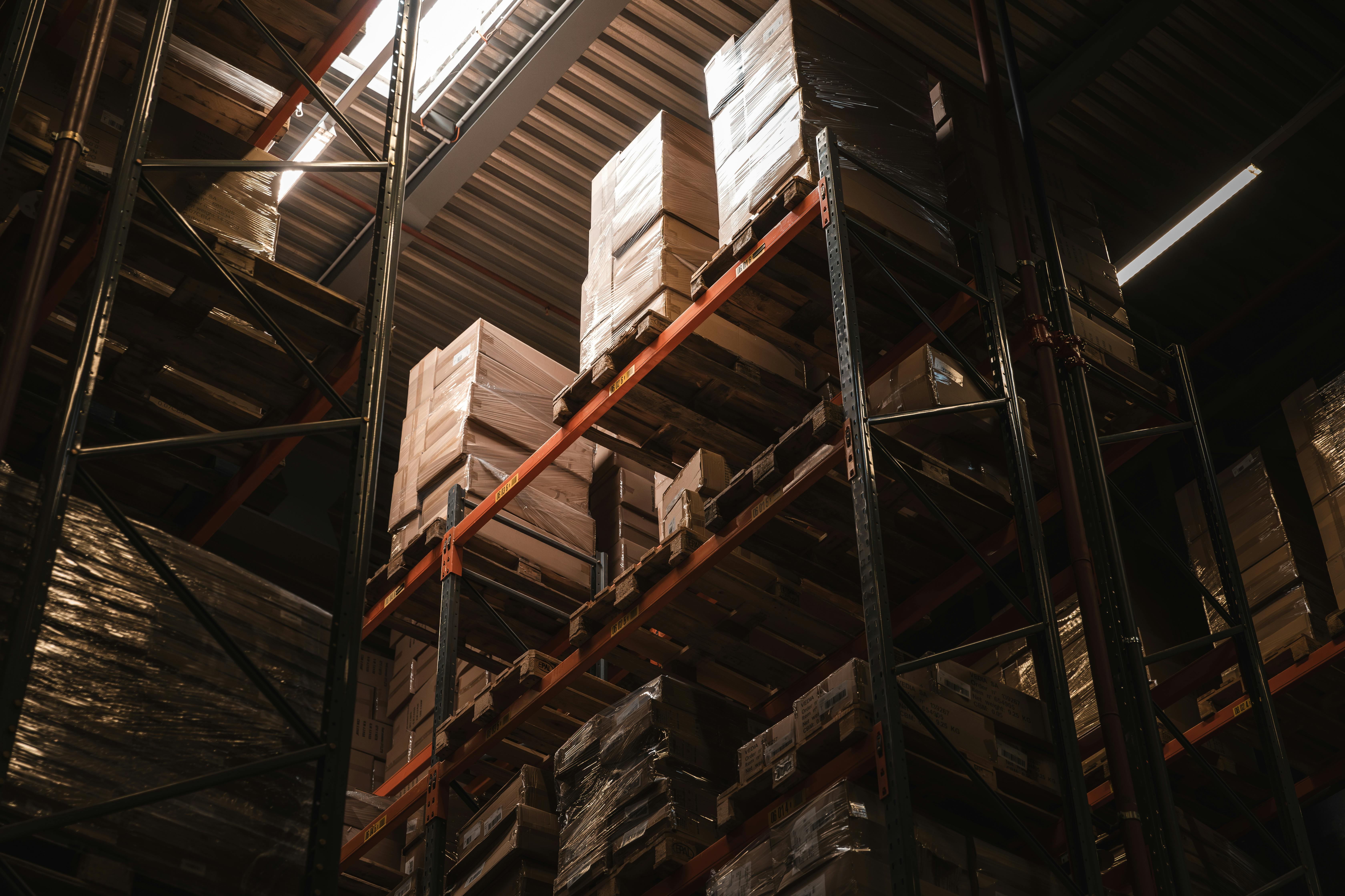 Low Angle Shot of Boxes Standing on the Shelves in a Warehouse