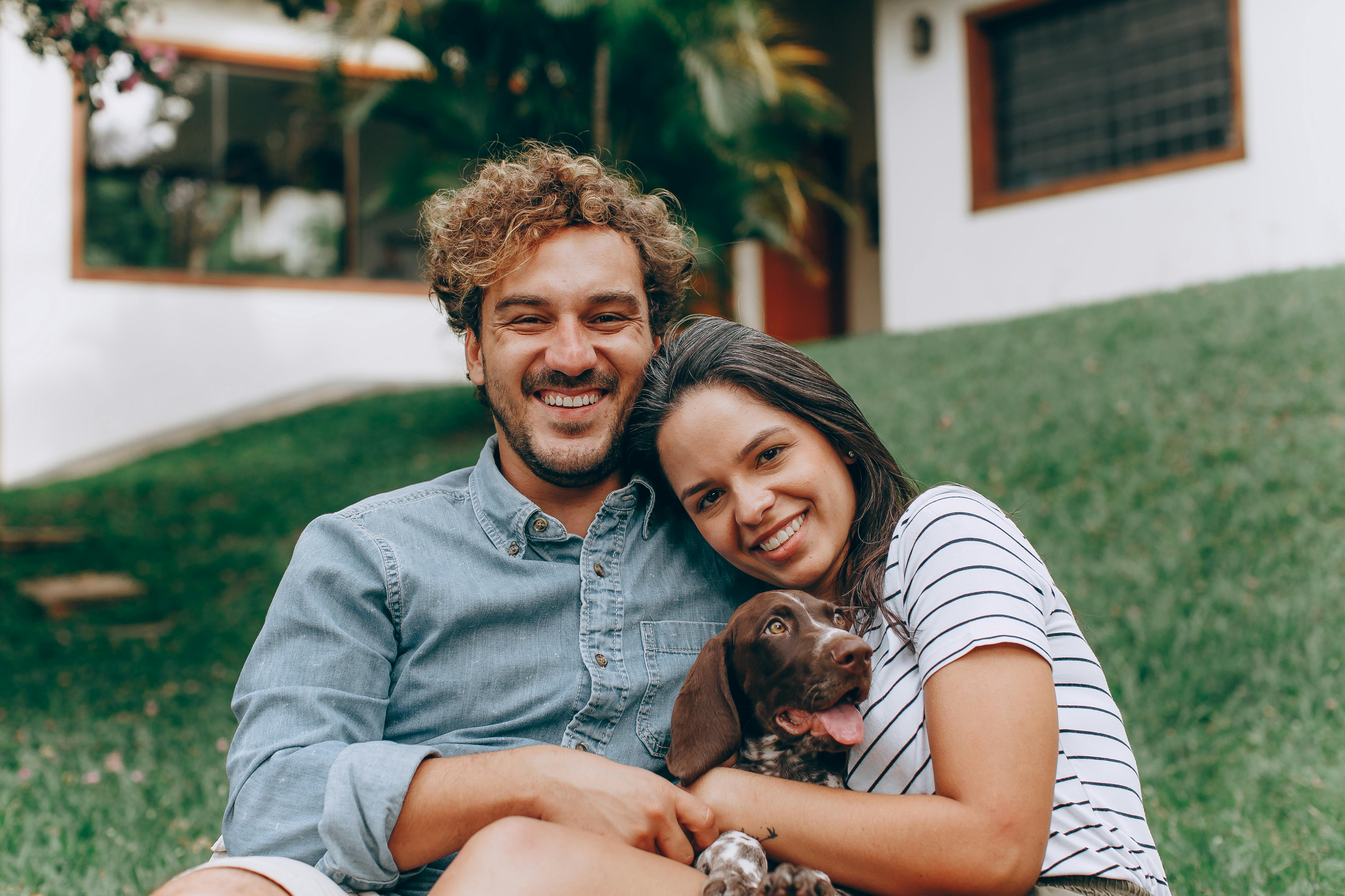 Portrait of Smiling Couple with Dog