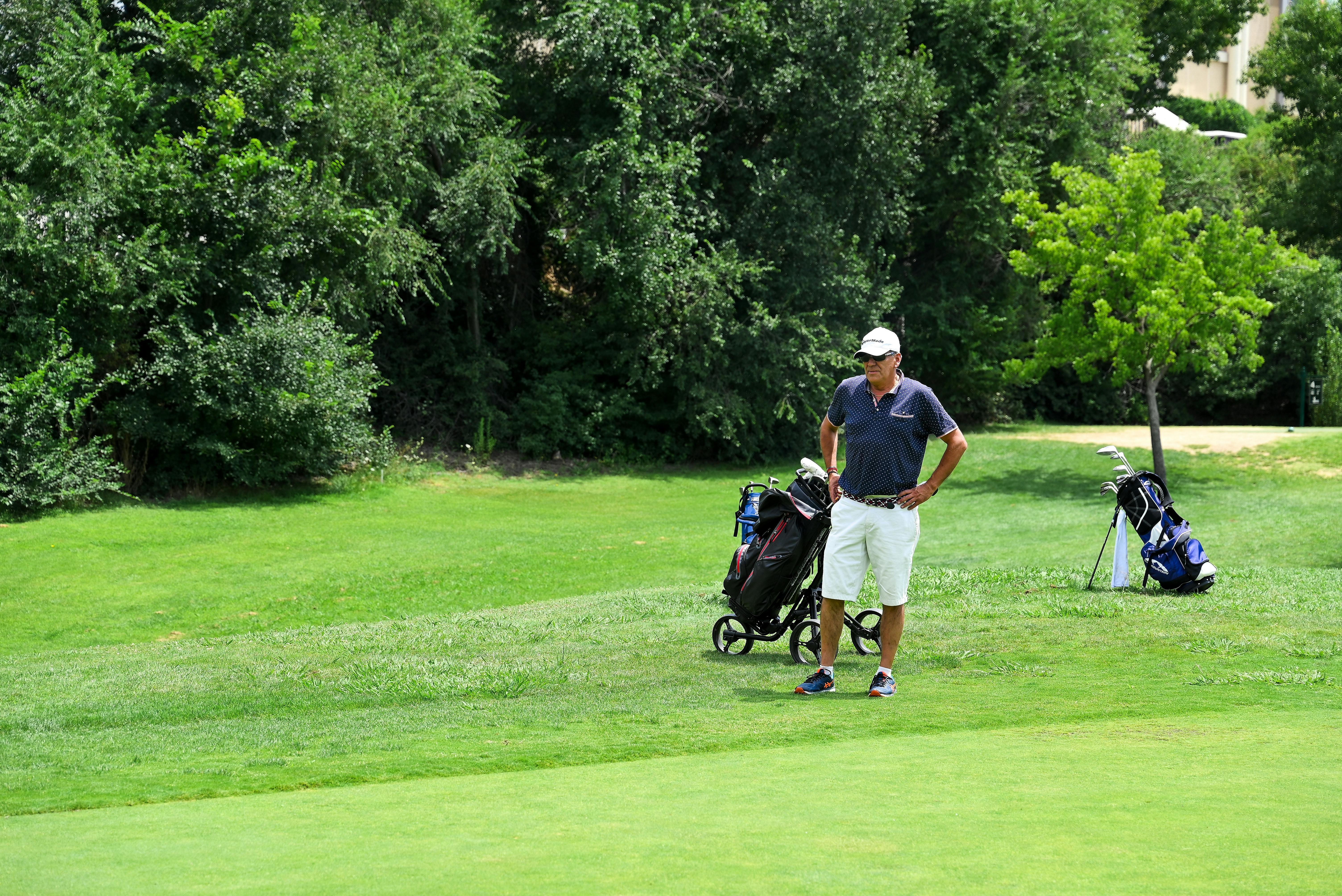 Man Playing Golf on a Field