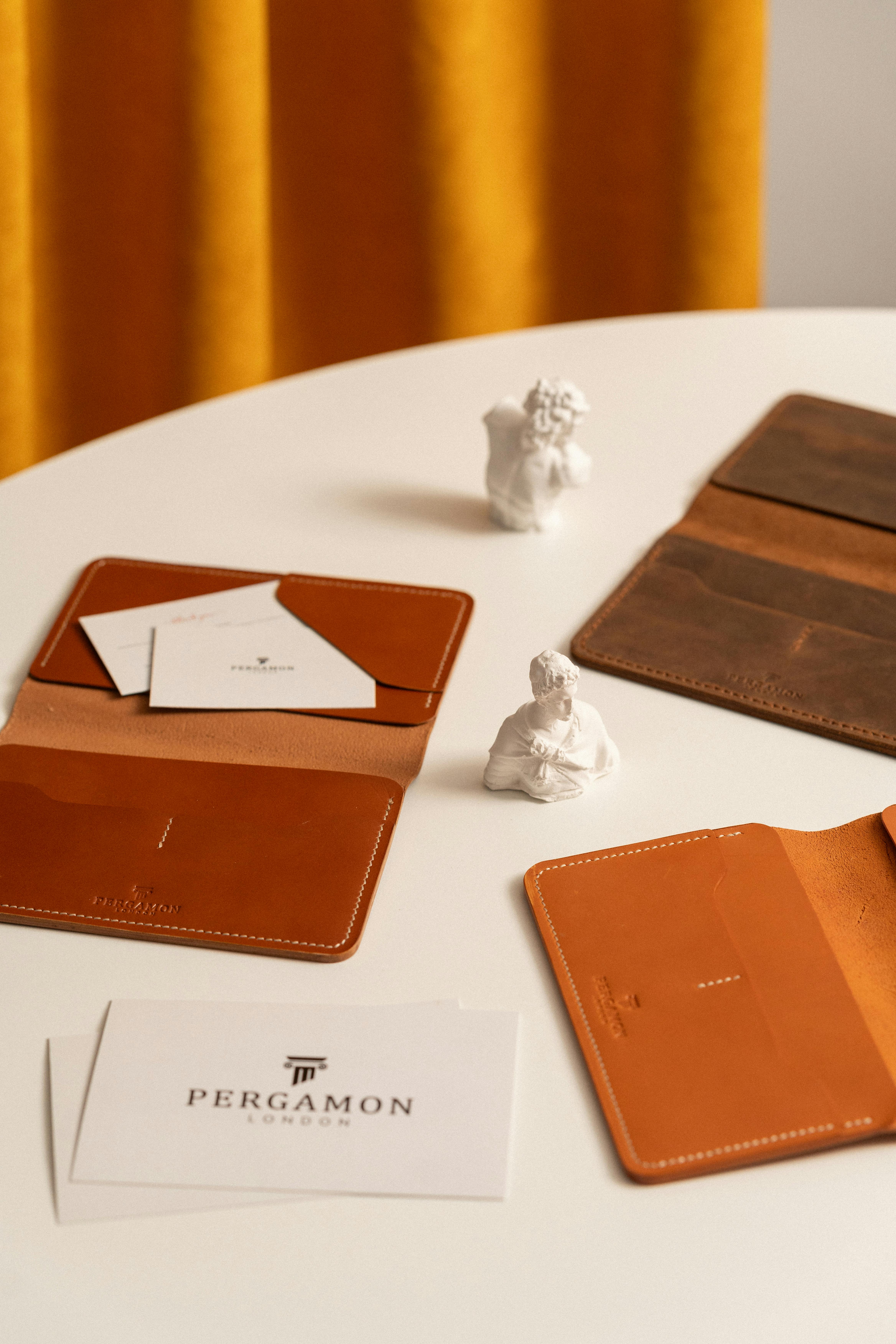 Leather Wallets on a White Table 