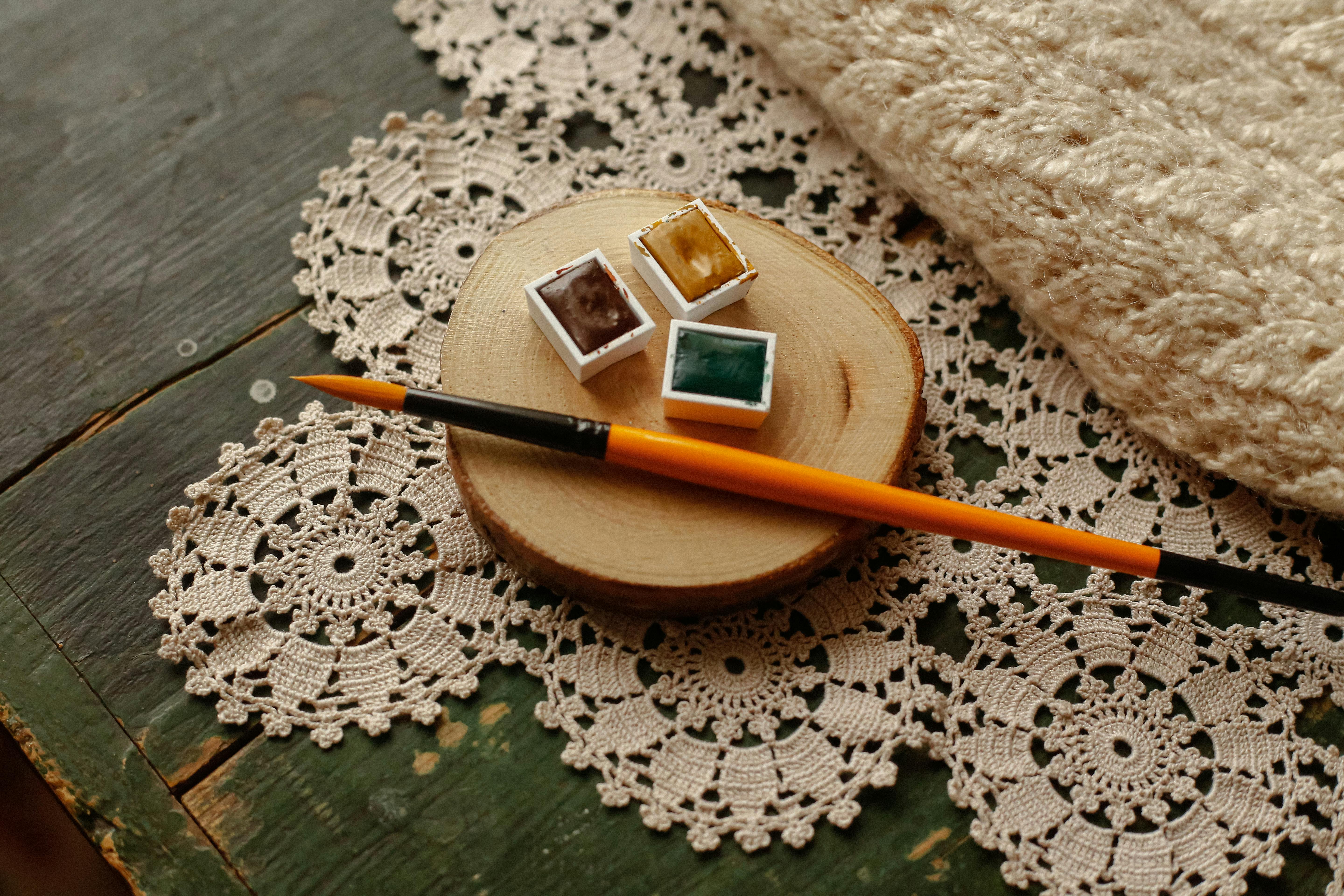 Art Supplies on Rustic Lace Surface