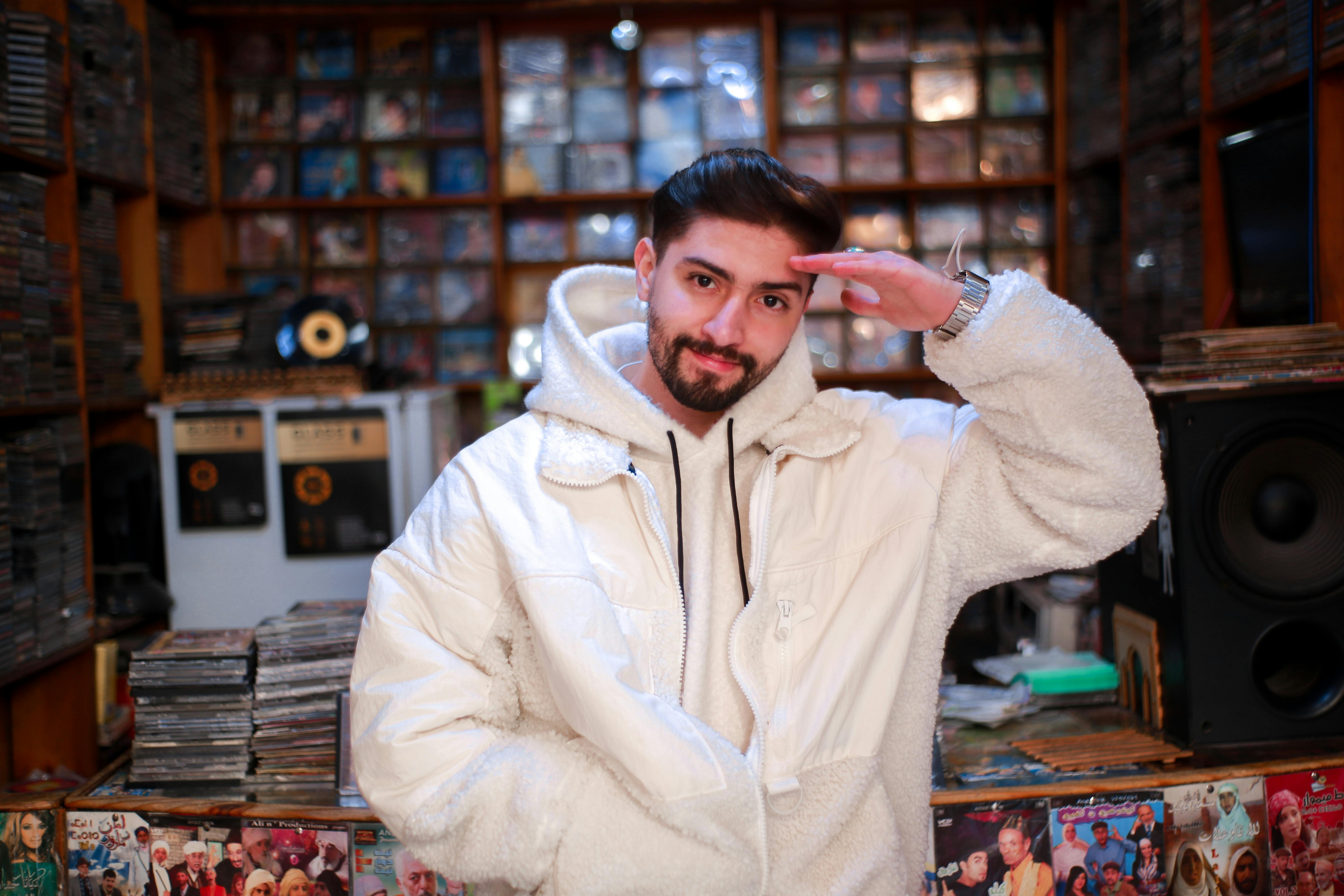 Young Man in Record Store Saluting