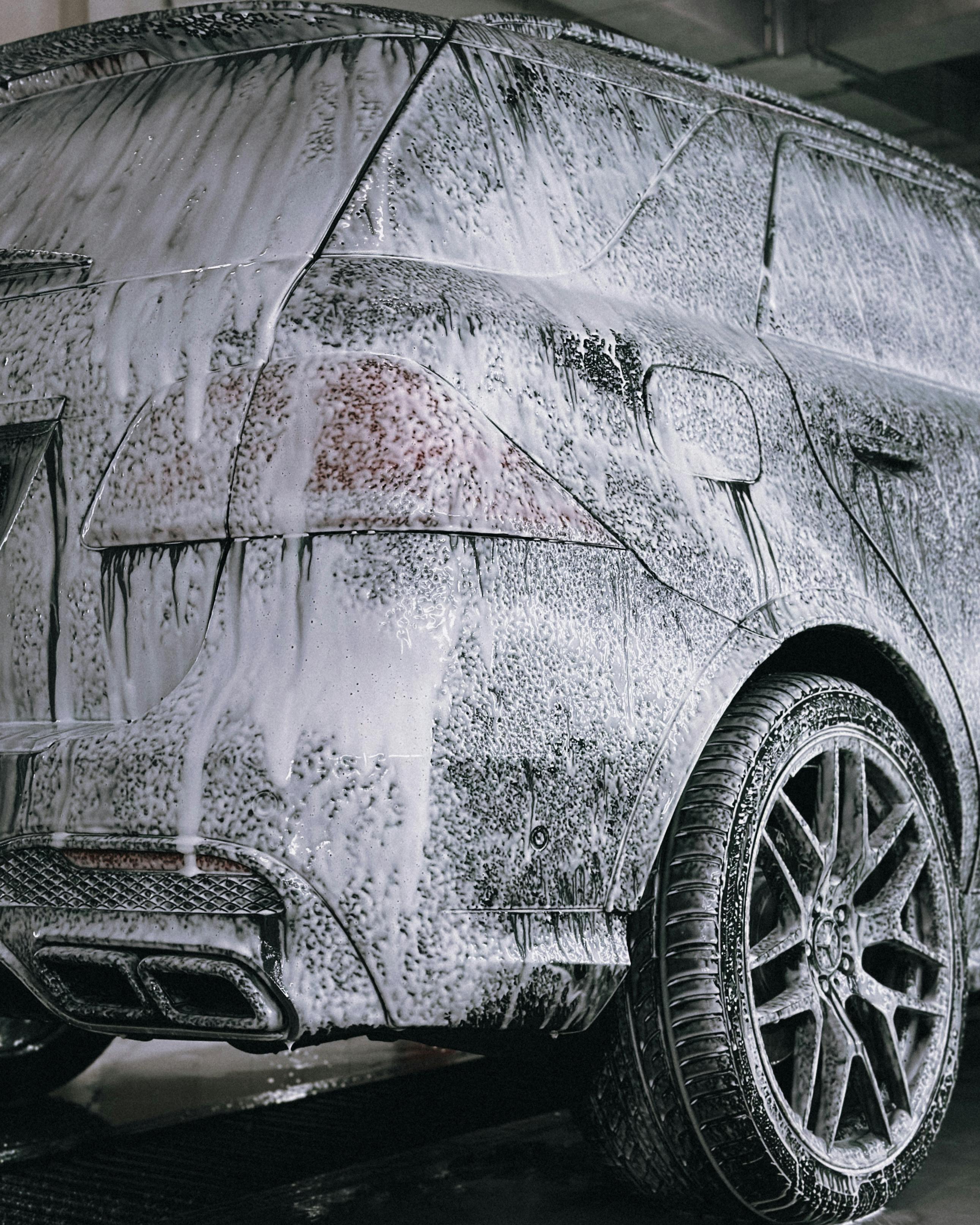 Luxury SUV Covered with Soap at Car Wash