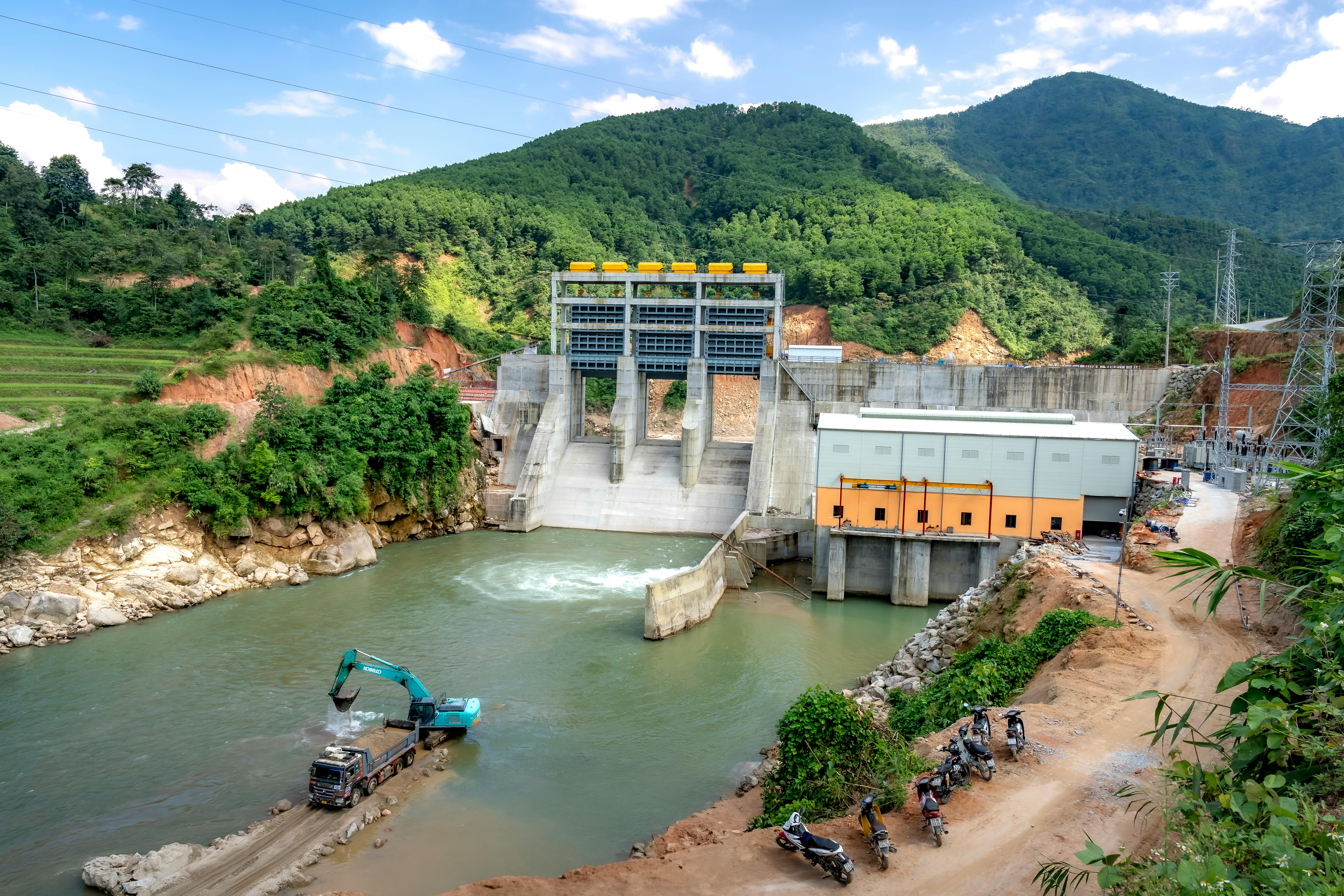 Modern Hydroelectric Power Plant in Lush Valley