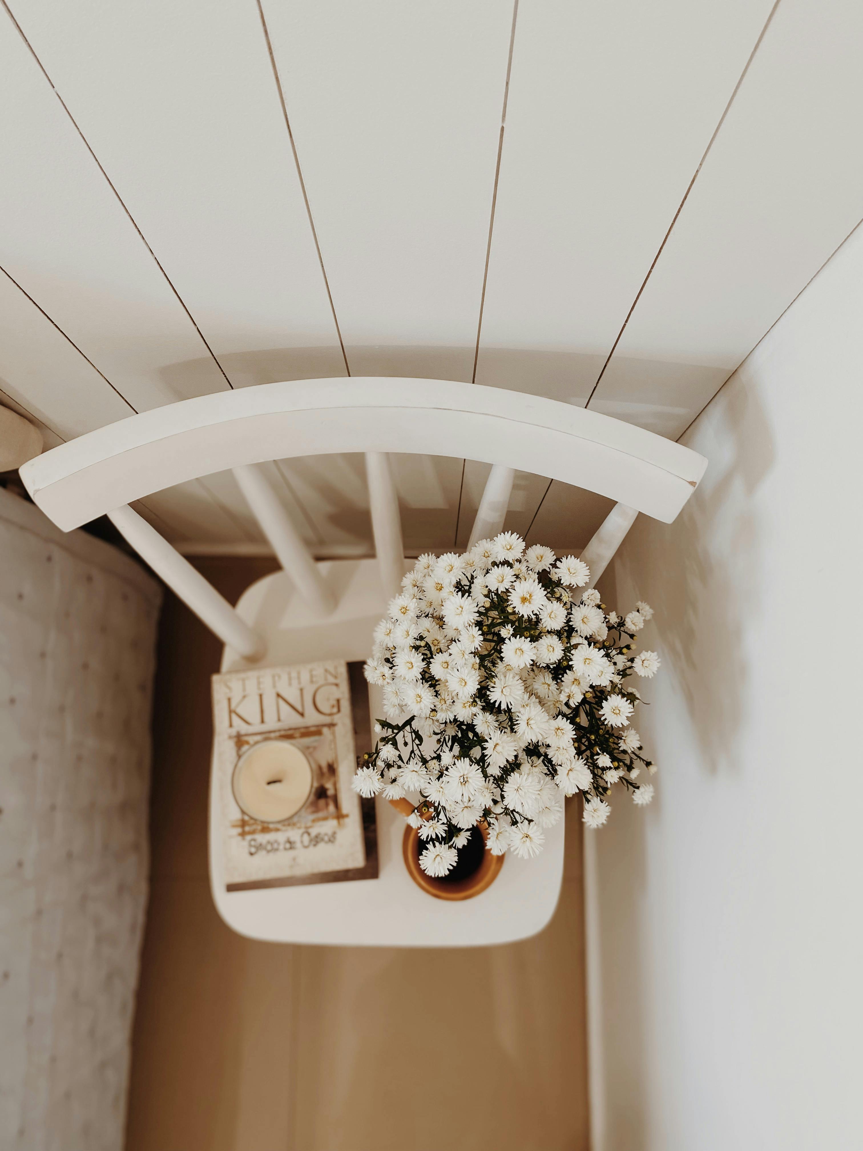 Cozy Minimalist Bedside with Flowers and Candle