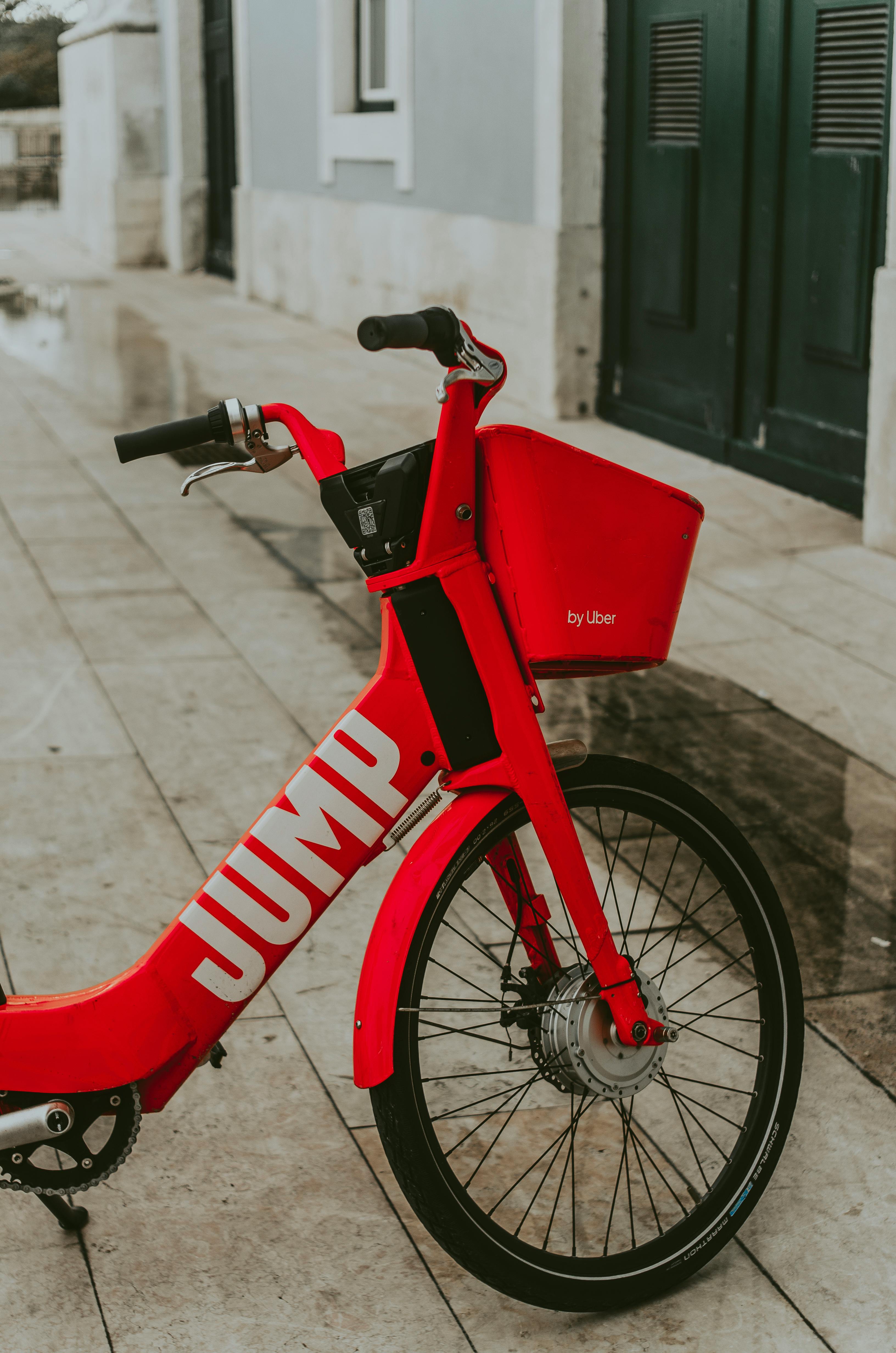 Red Bicycle Parked Near Door