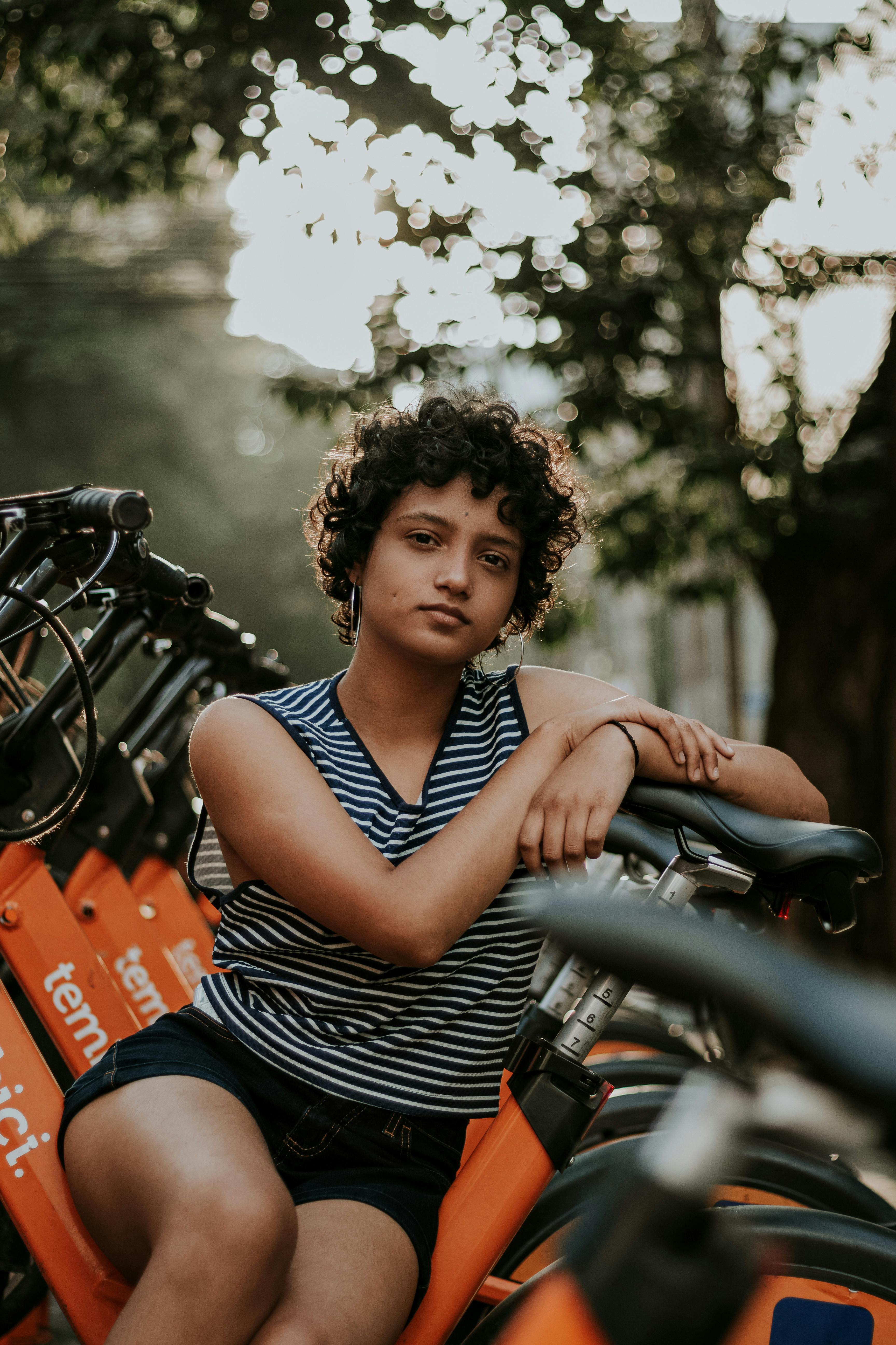 Woman Sitting On A Bike