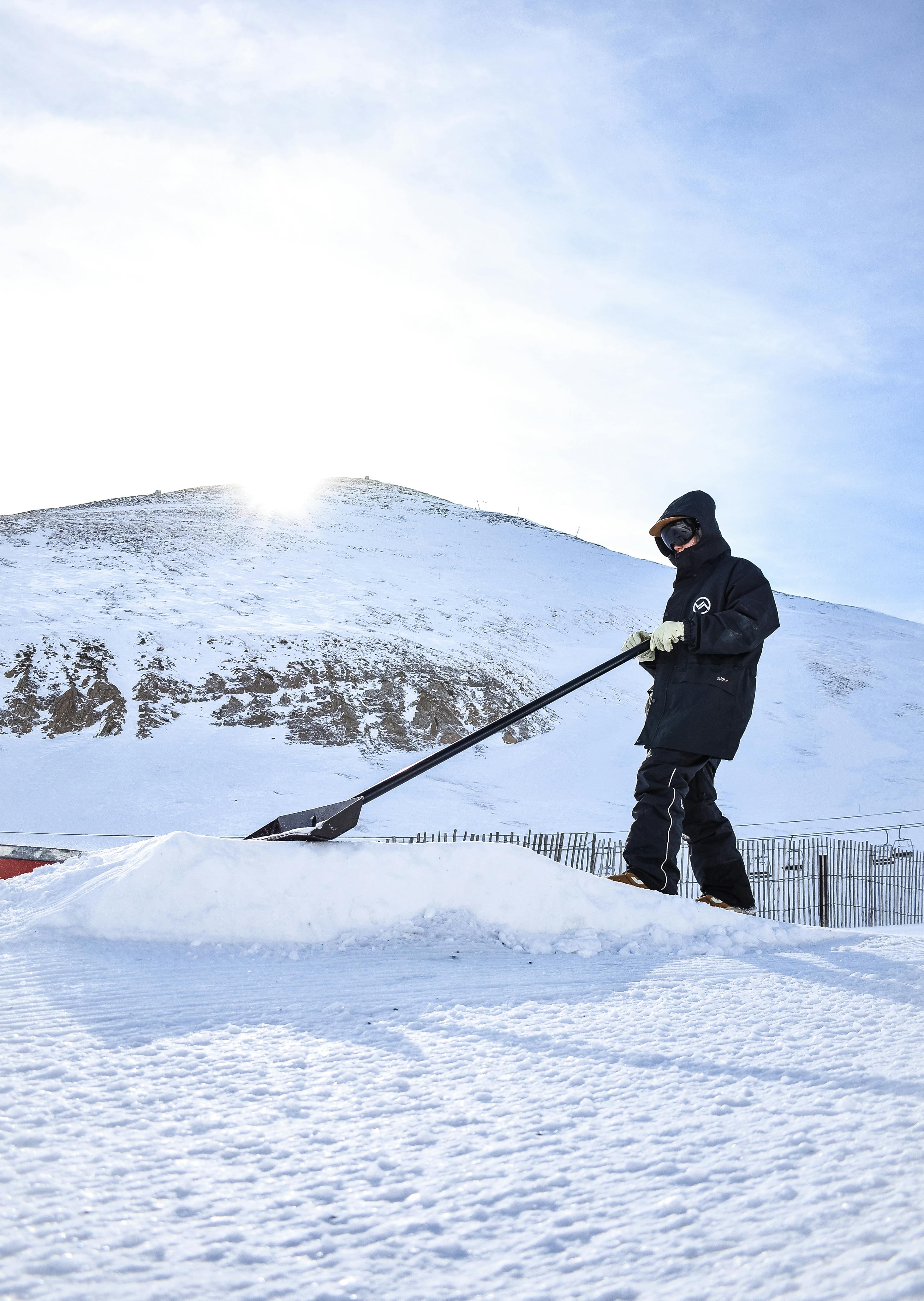 Man Holding Snow Shovel