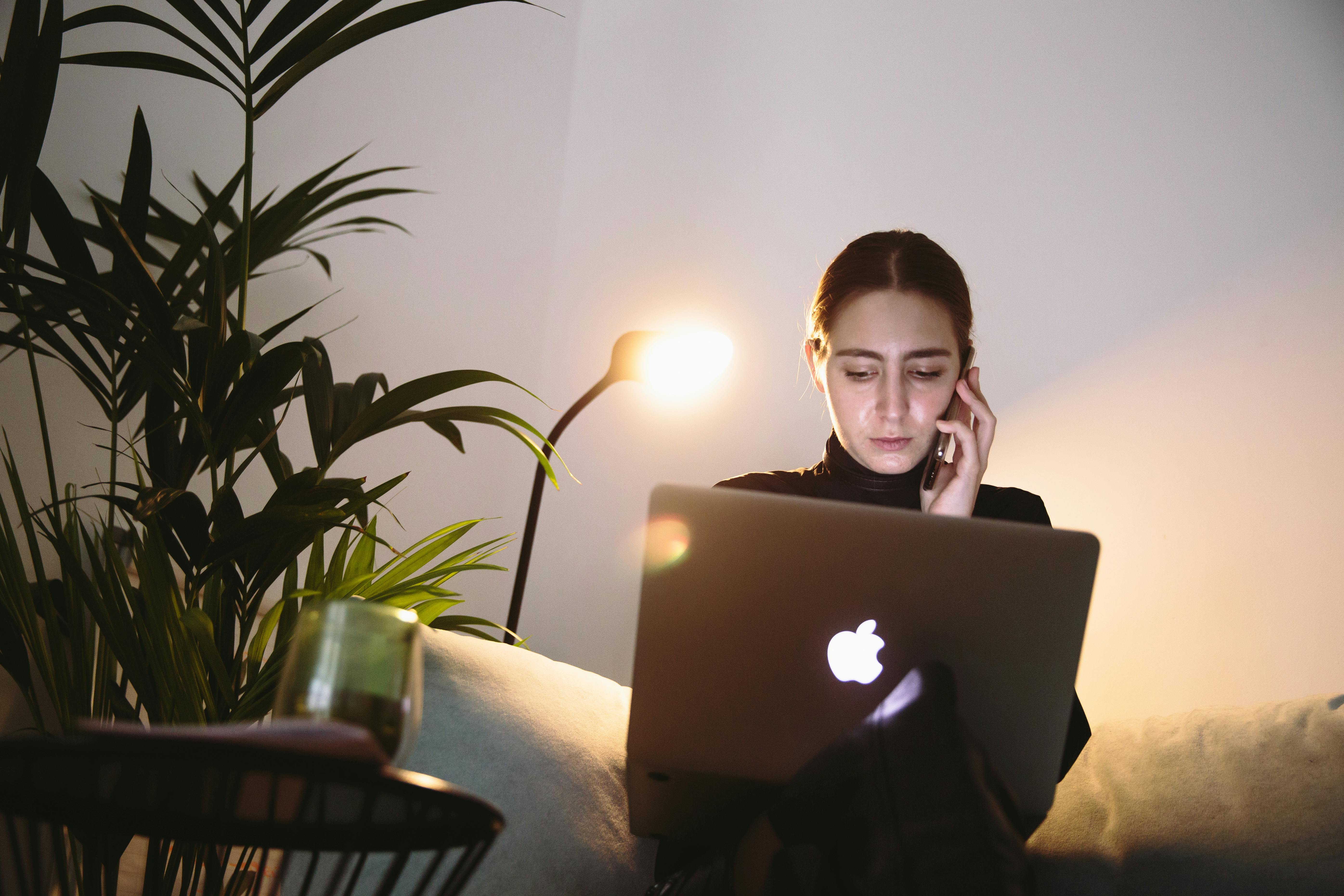 Photo Of Woman Sitting Beside Plant