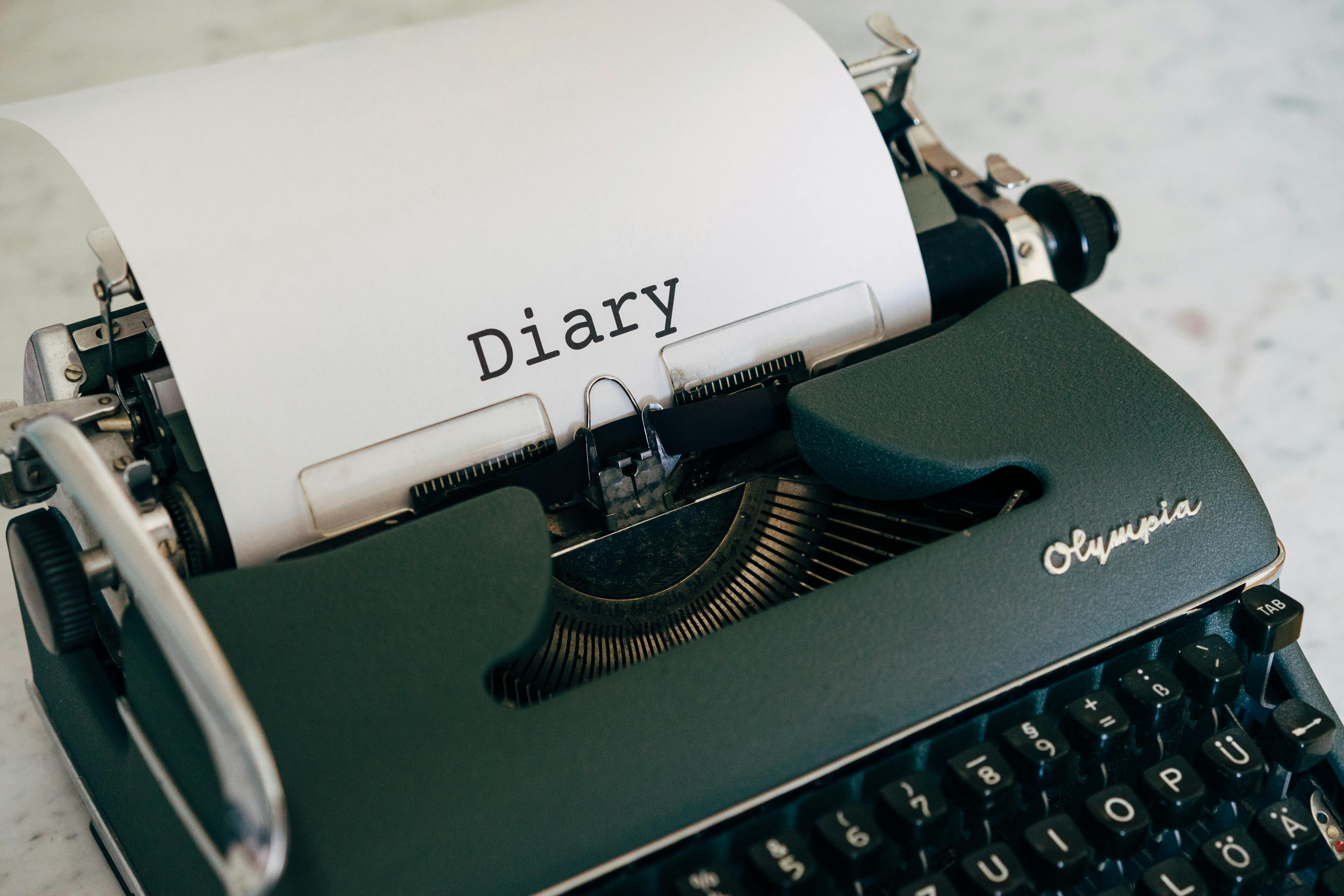 An Old Typewriter on White Table