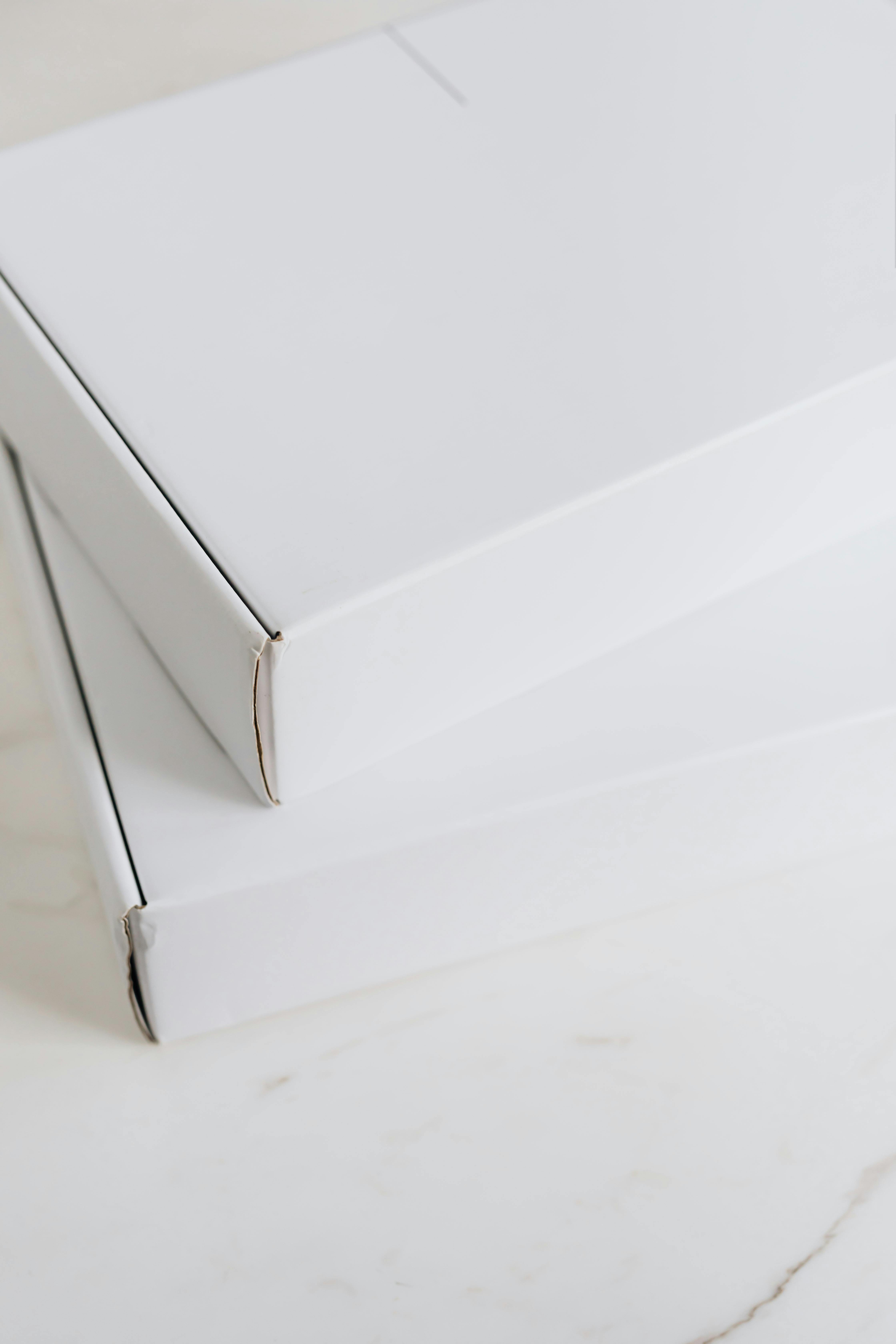 Two Boxes on a White Surface