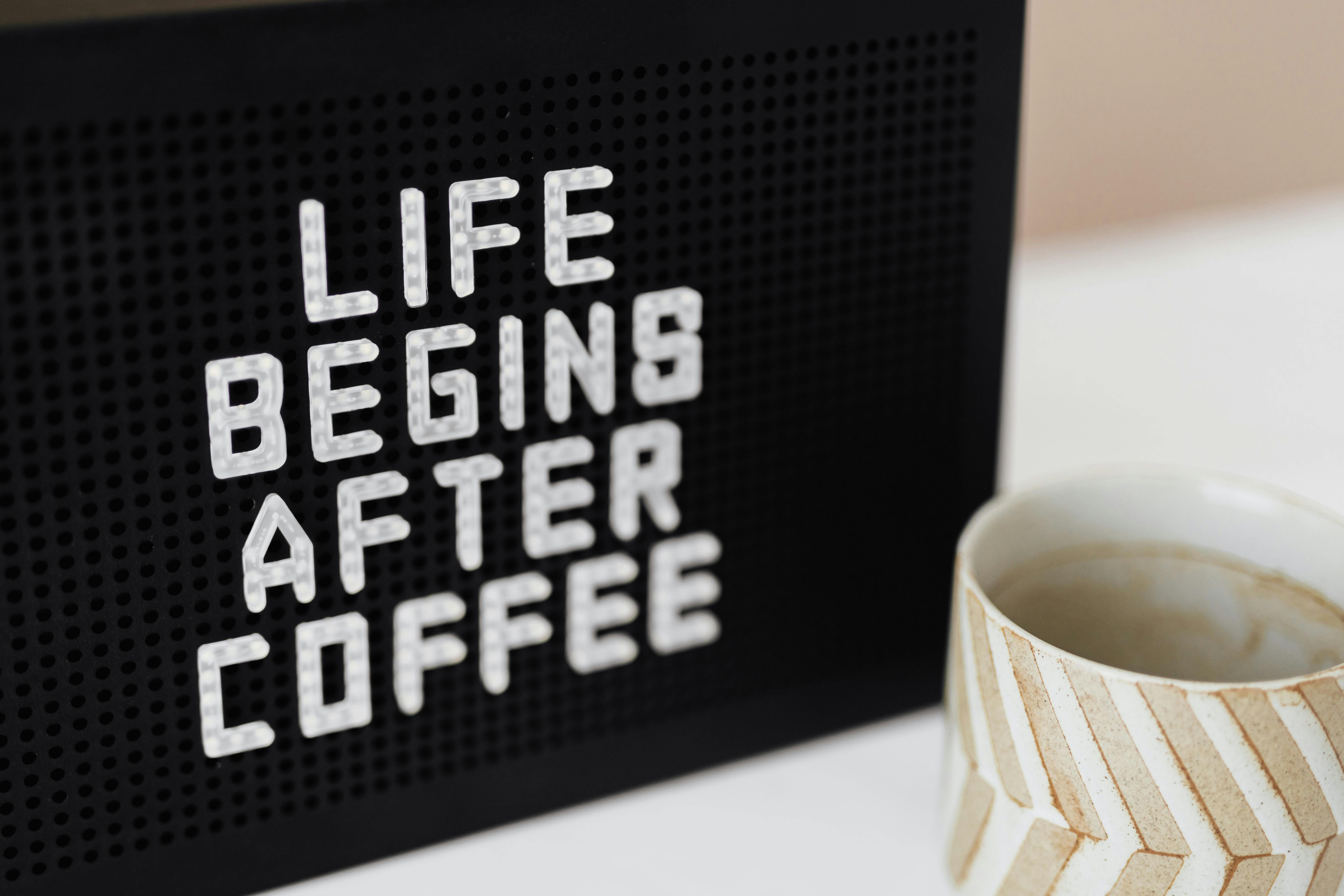 Peg message board with Life Begins After Coffee motto