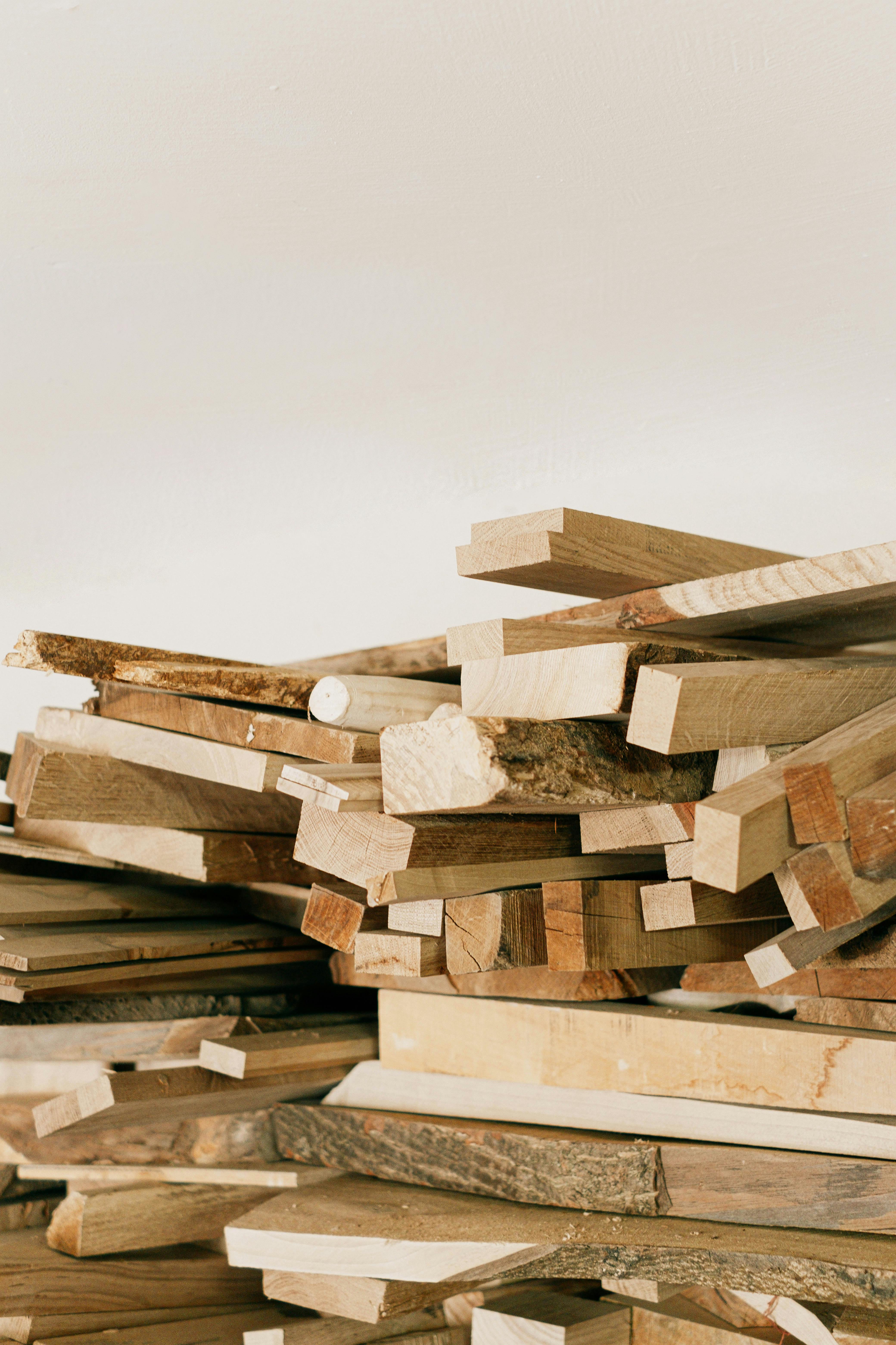 Brown Wooden Log Stack on White Background