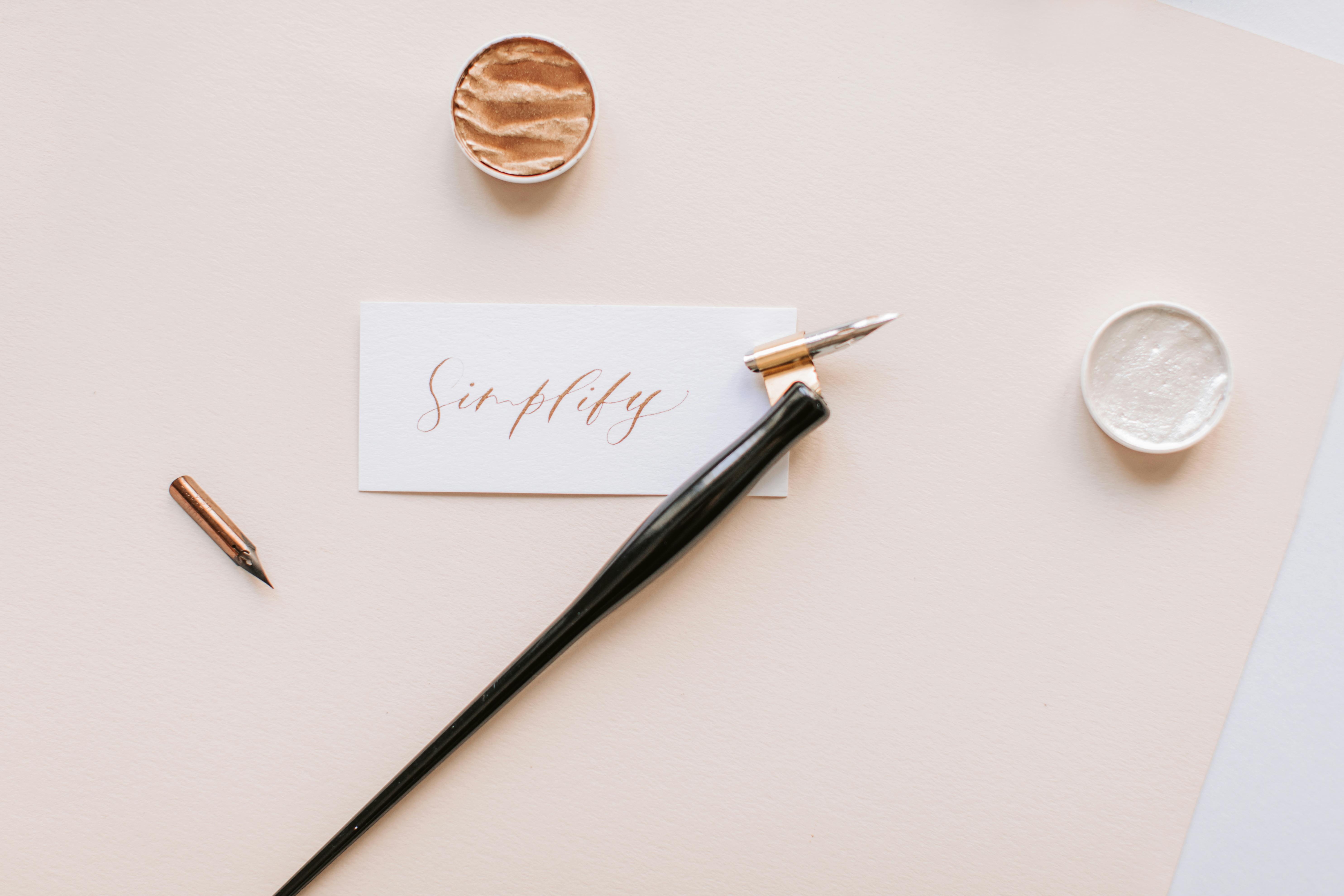 Close-Up Photo Of Sticky Note Beside Pen 