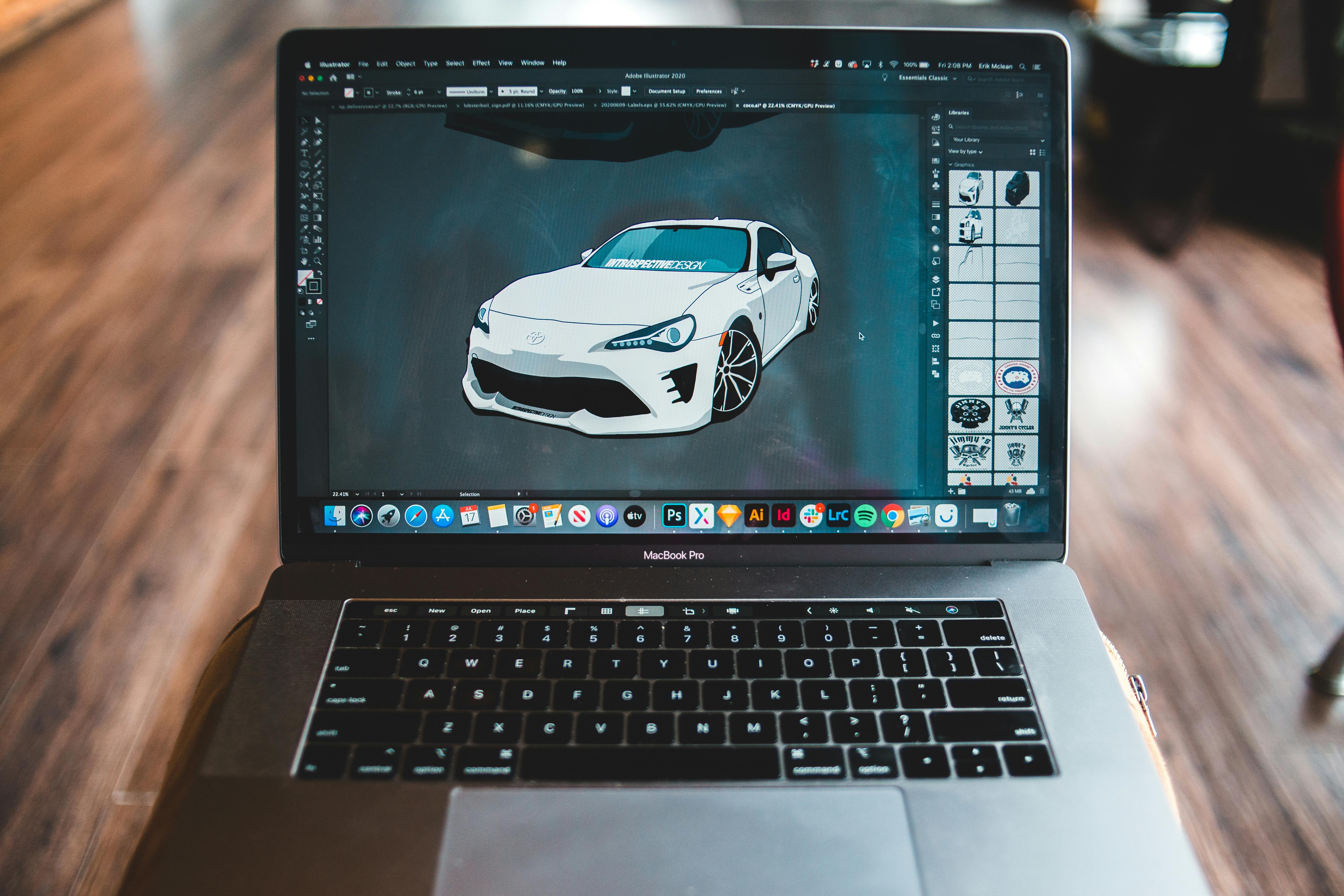 Picture of sports car in graphic editor application on screen of modern laptop