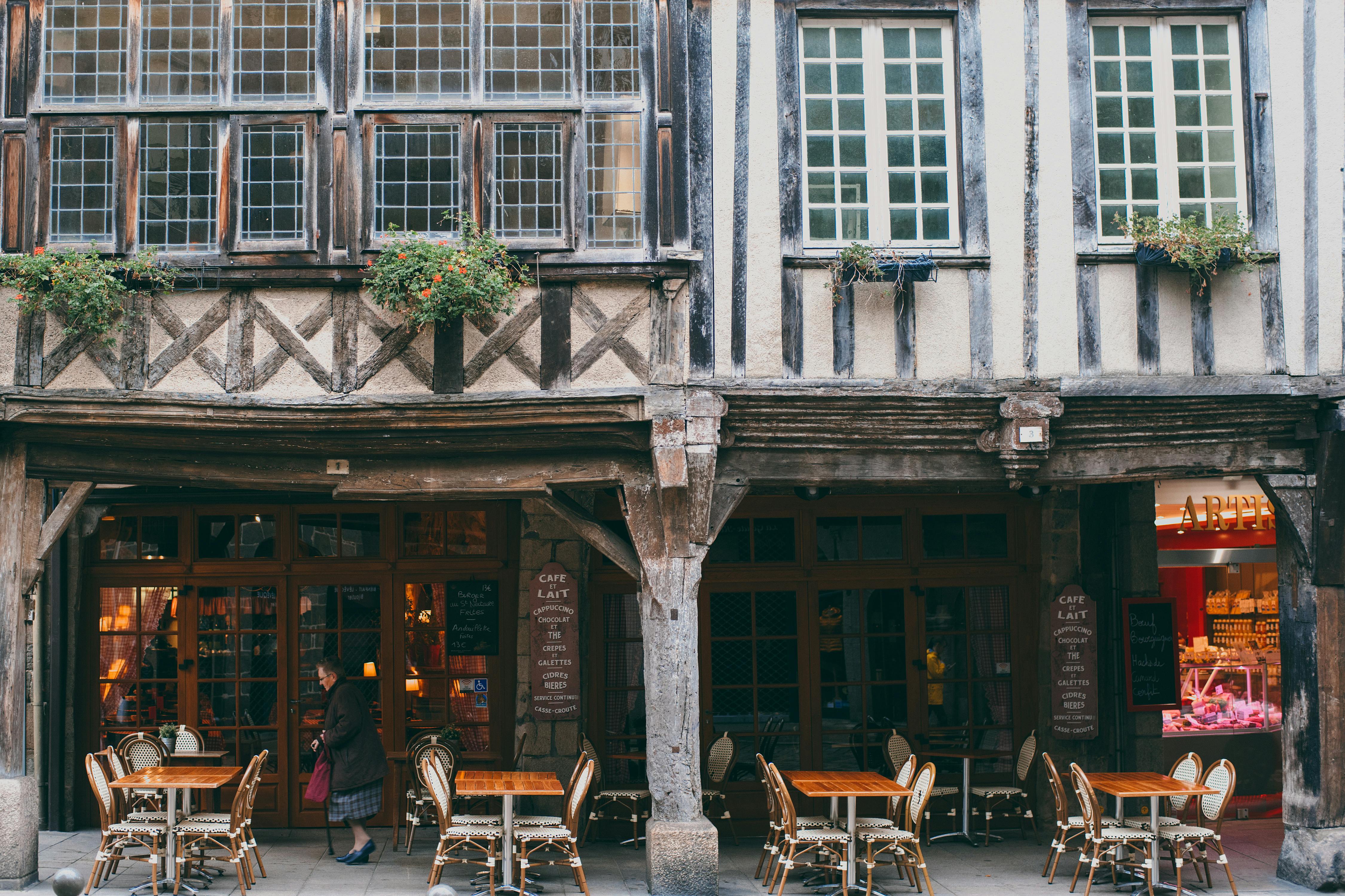 Exterior with authentic stone building with outdoor cafe