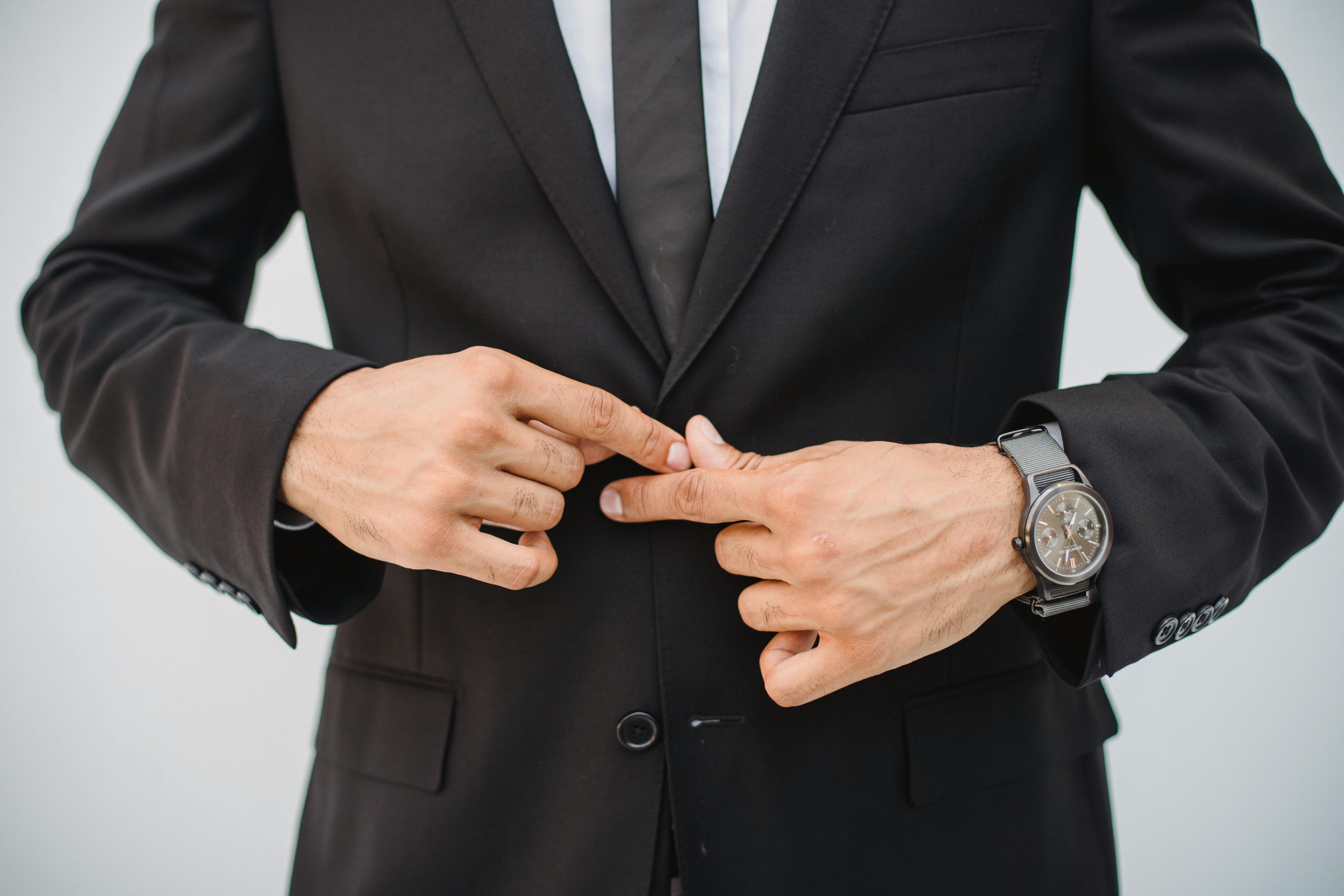 Close-Up Shot of a Person Wearing Black Suit