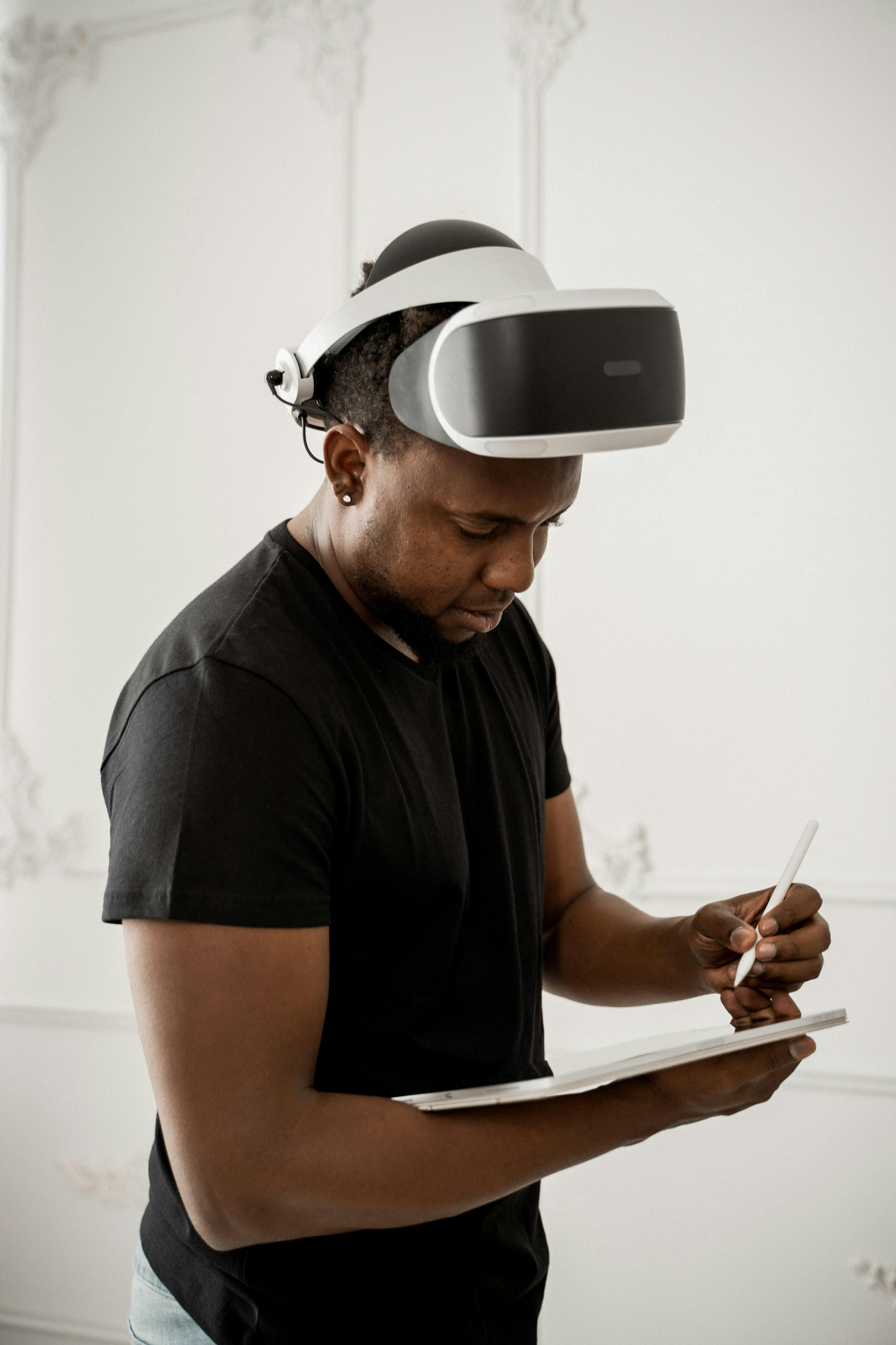 Man in Black Crew Neck T-shirt Wearing White and Black Vr Goggles