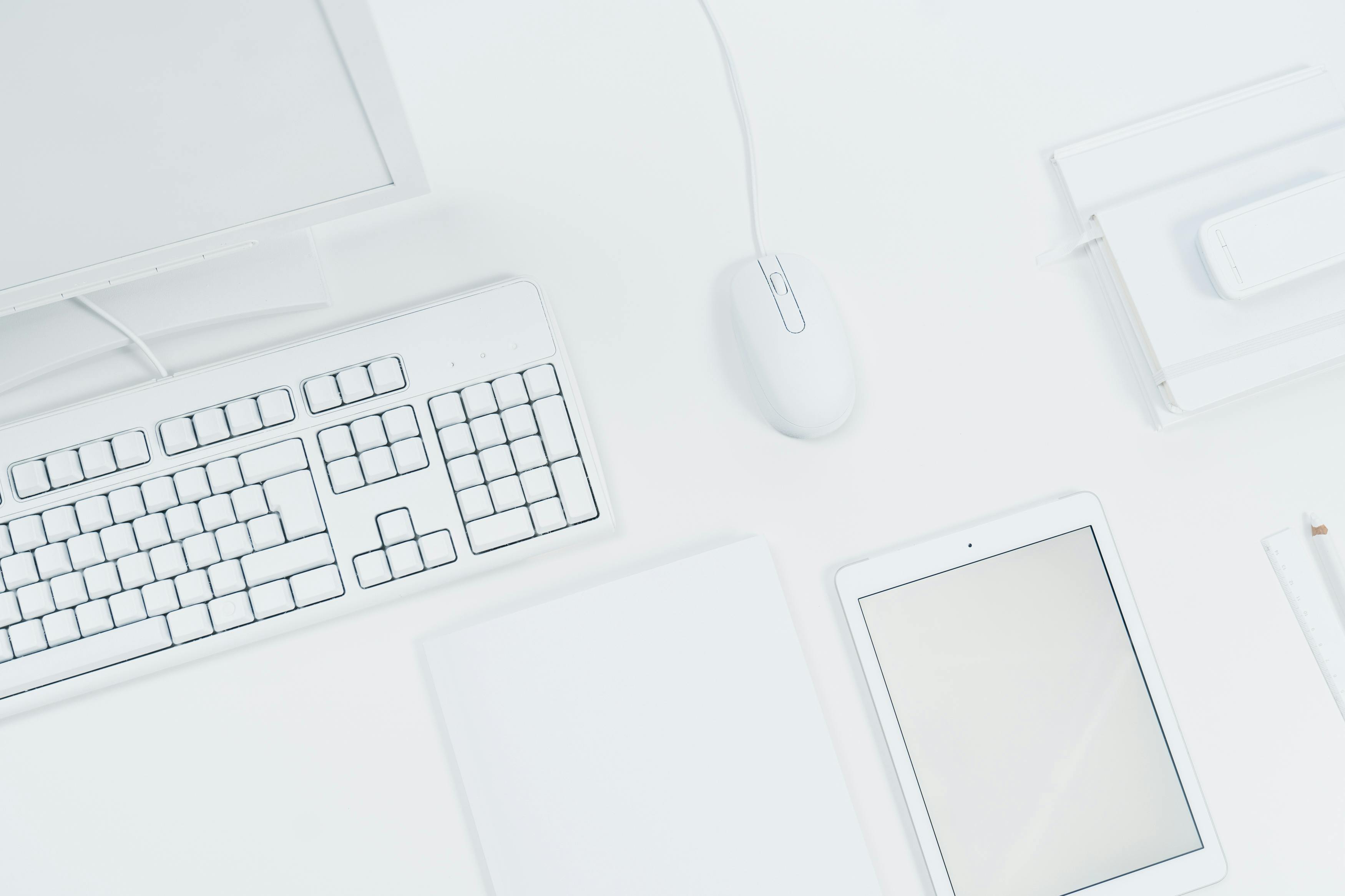 White Tablet and Computer Set of a Desk