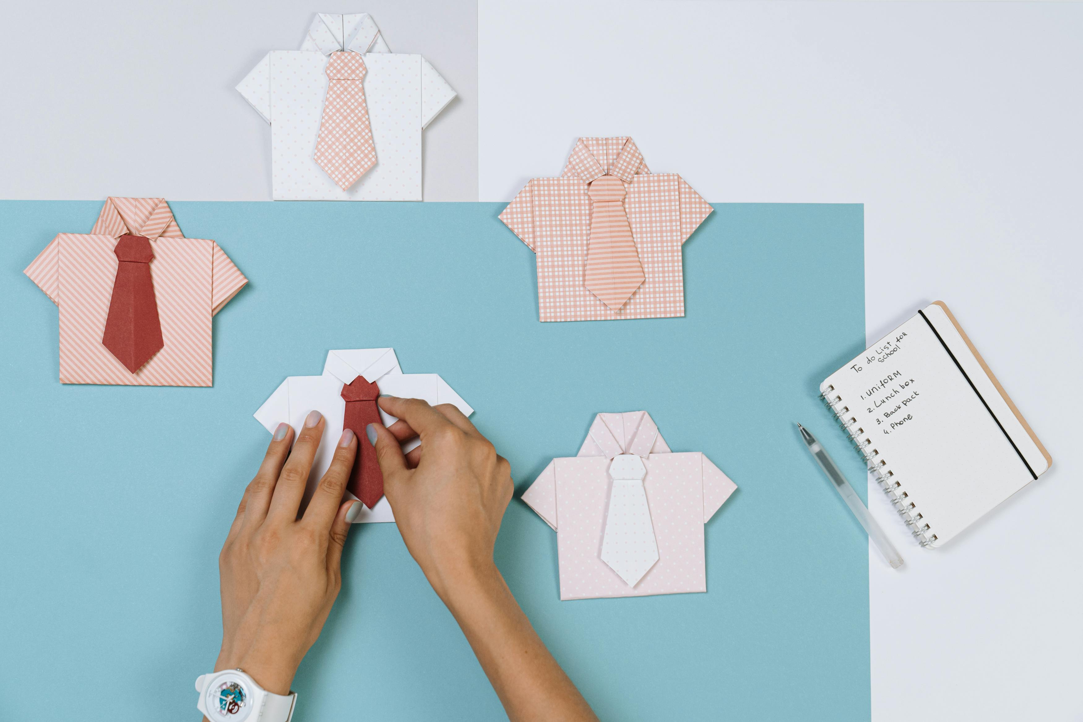 Person Making a Shirt and Tie Origami
