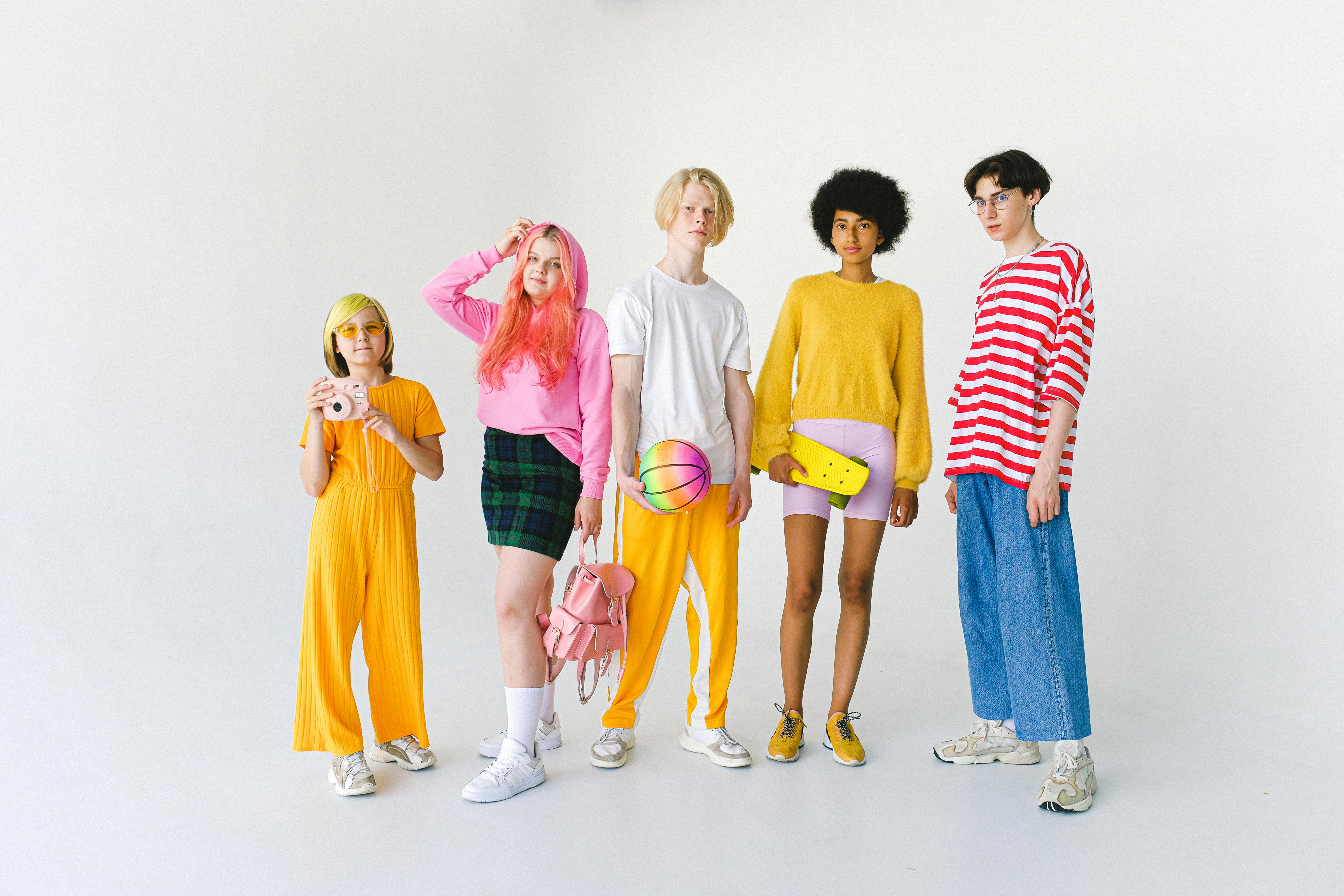 Group of diverse teenagers in colorful outfits