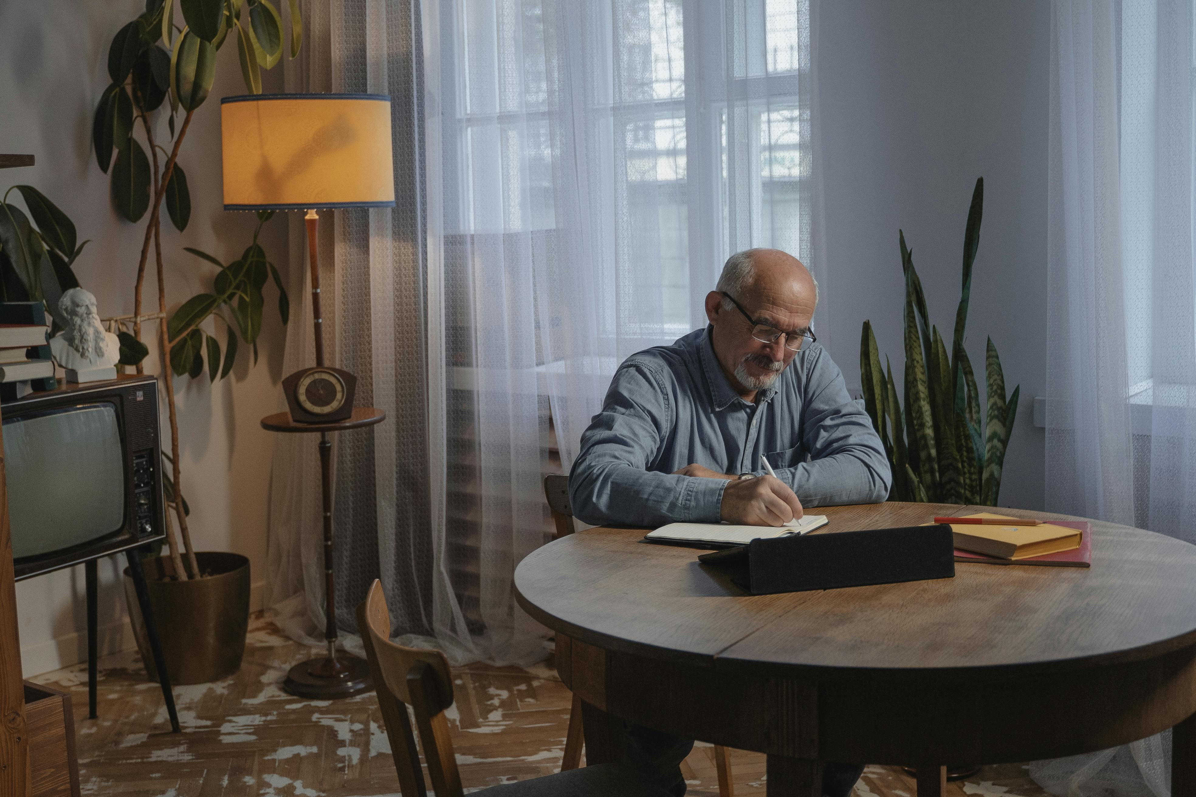Elderly Man Working at Home