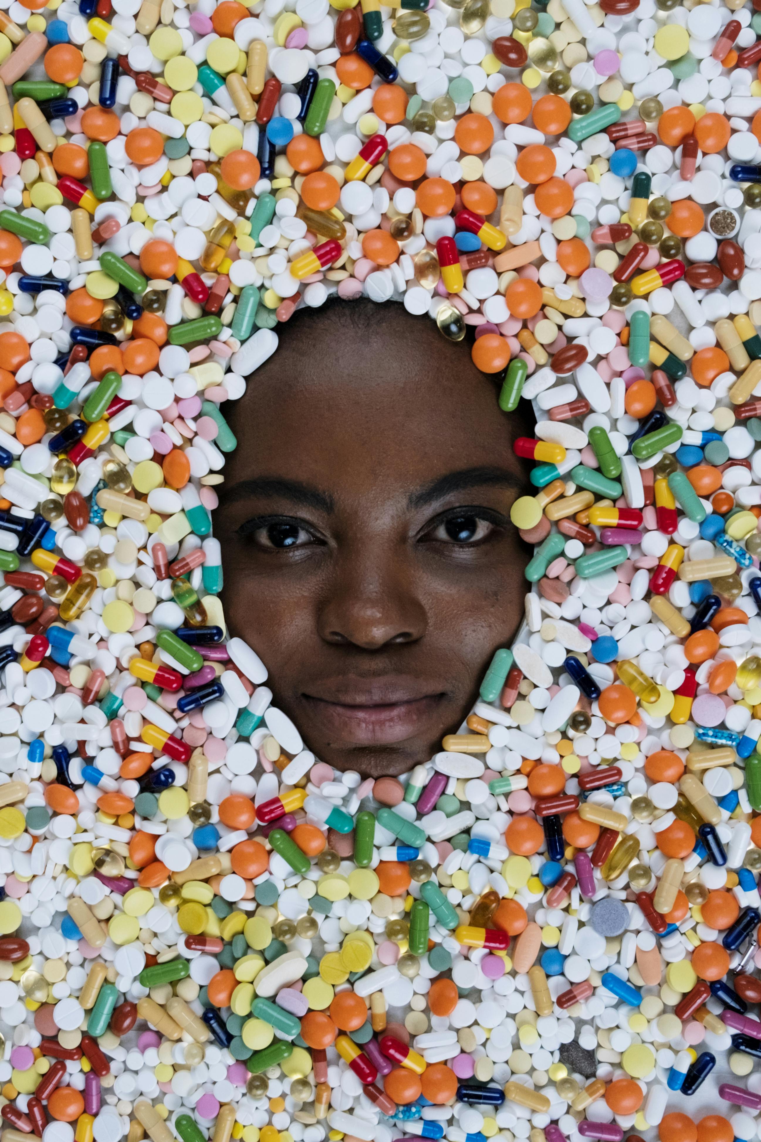 Assorted Medicines Surrounding the Person's Face
