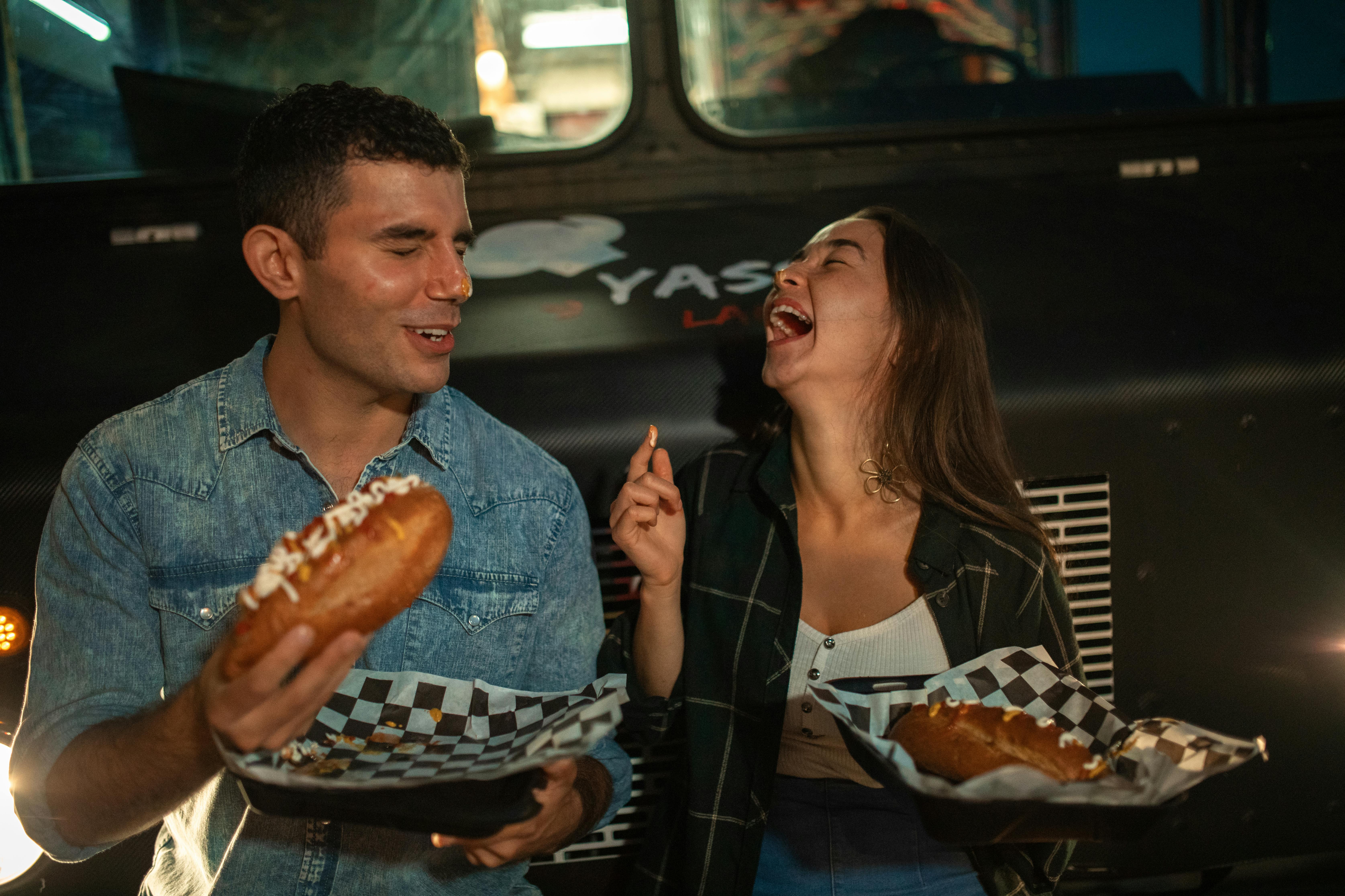 Happy Couple eating Delicious Food Together