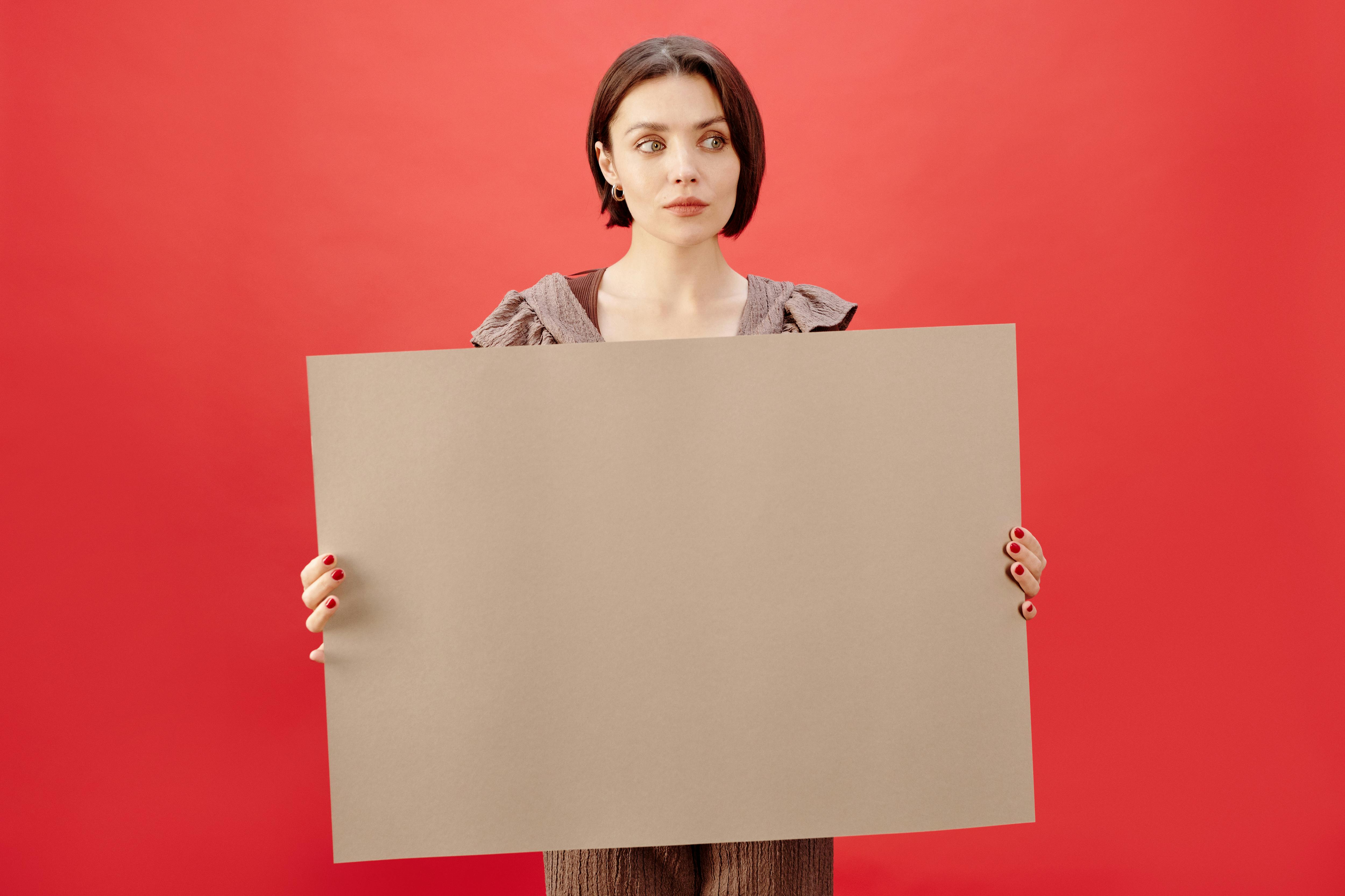 Woman Holding a Board